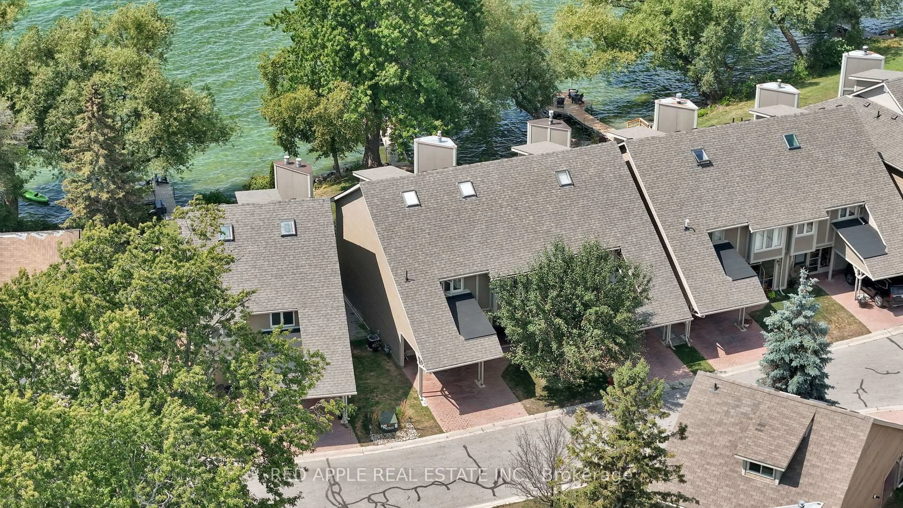 A pic from outside/outdoor area/front of a property/back of a property/a pic from drone, water/lake/river/ocean view for 12 Davy Point Circ, Georgina Ontario L4P 3H2
