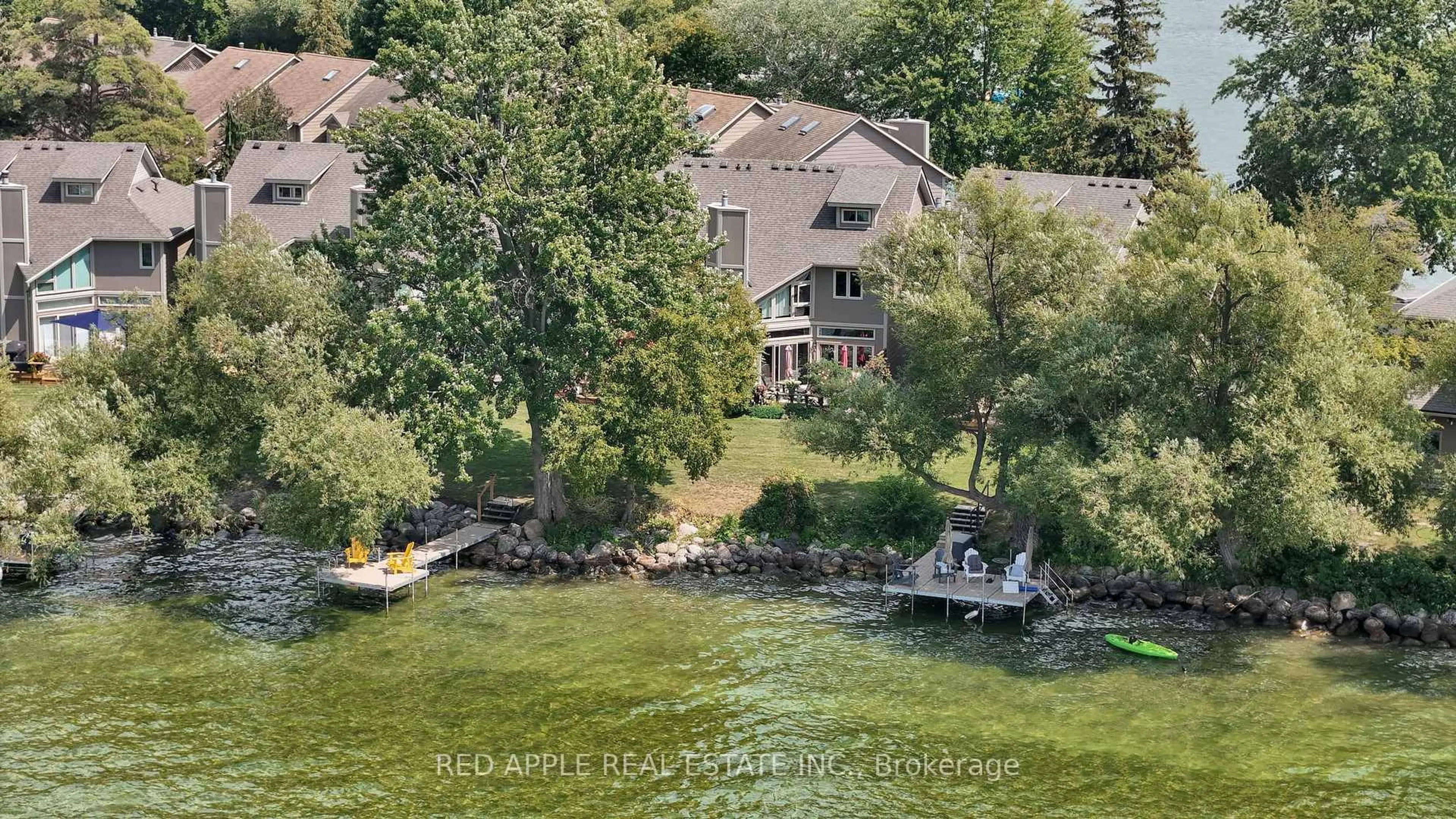 A pic from outside/outdoor area/front of a property/back of a property/a pic from drone, water/lake/river/ocean view for 12 Davy Point Circ, Georgina Ontario L4P 3H2