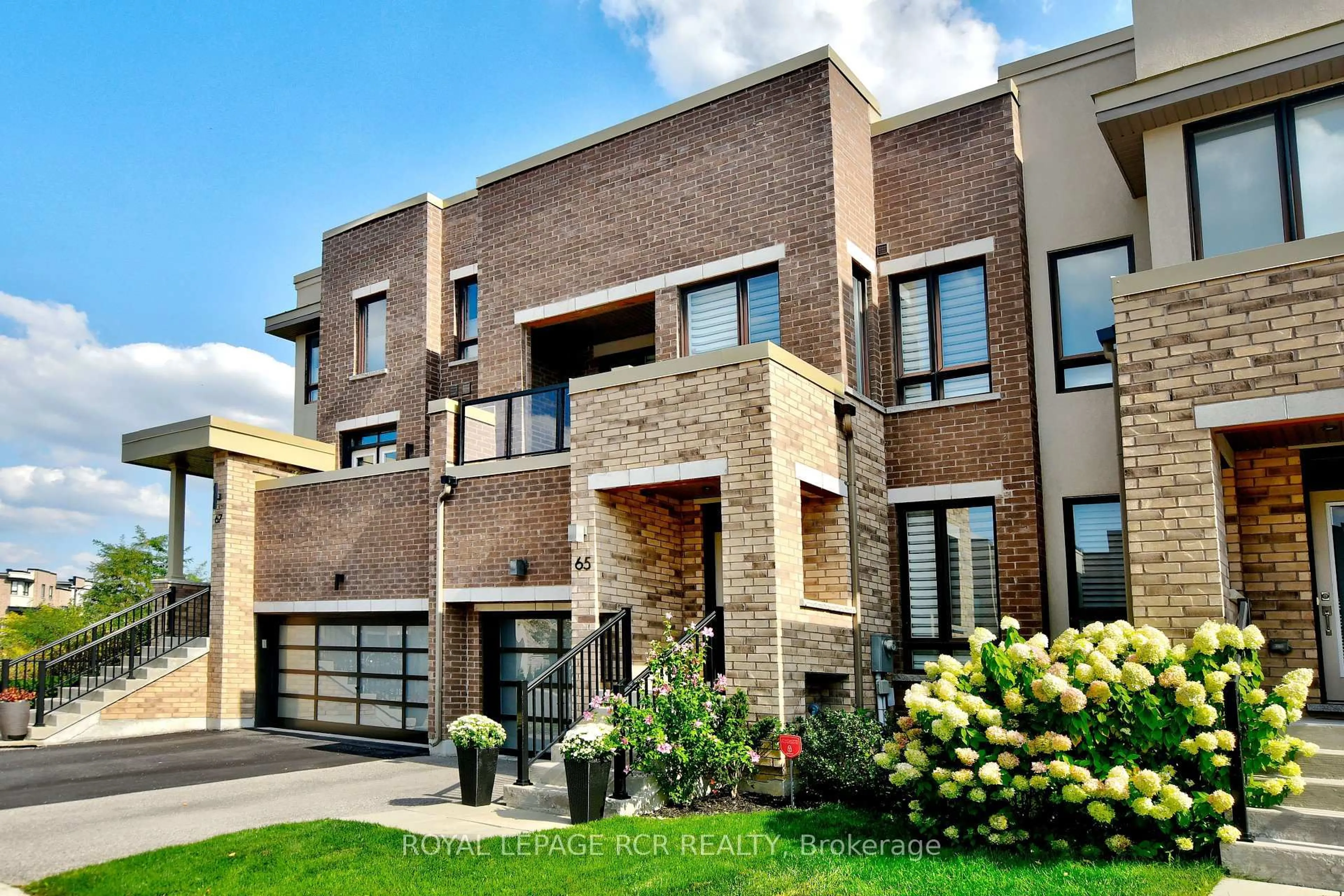 Home with brick exterior material, street for 65 Anchusa Dr, Richmond Hill Ontario L4E 1C6