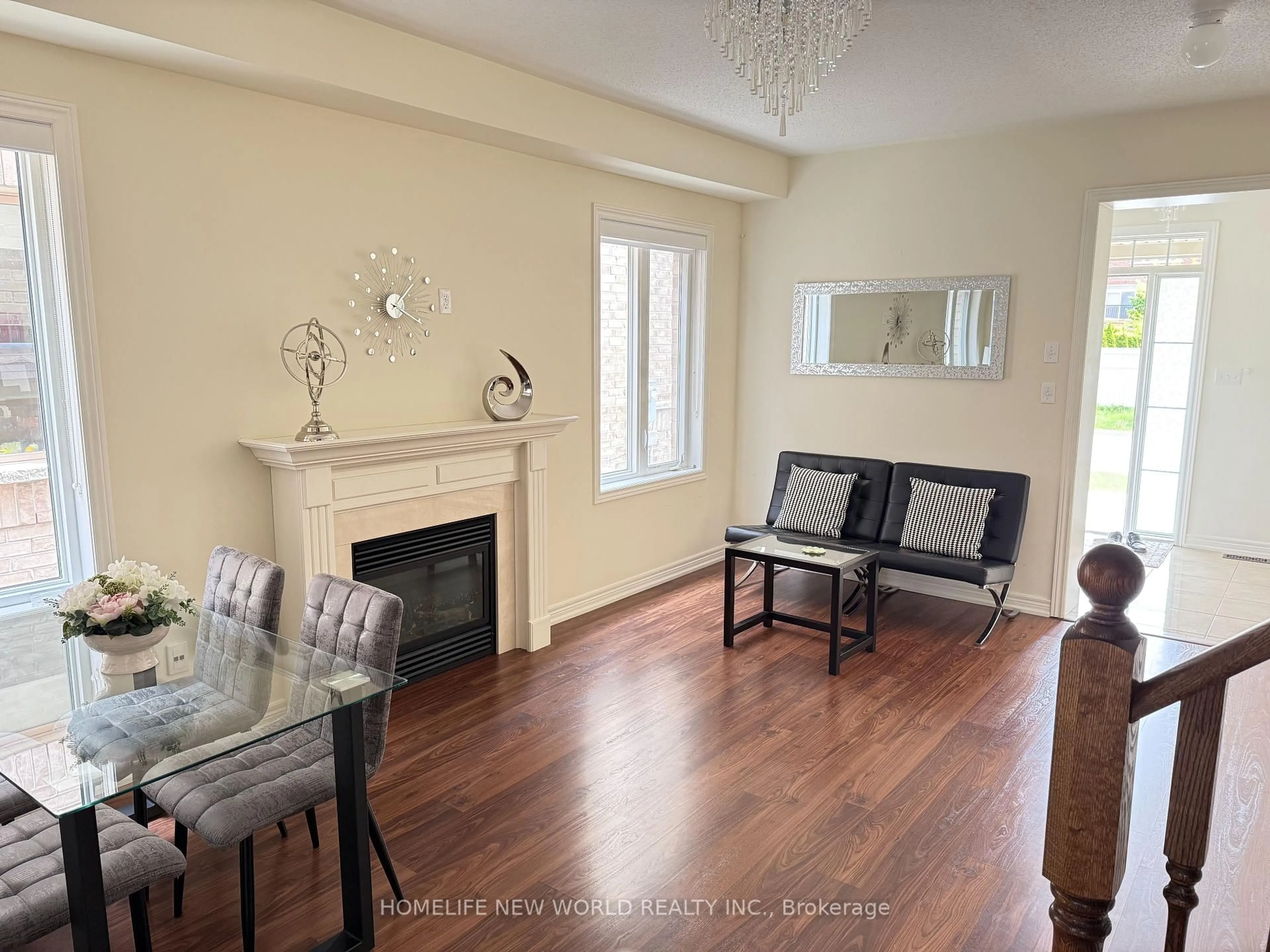 Living room with furniture, wood/laminate floor for 55 Frederick Stamm Cres, Markham Ontario L6C 0X3
