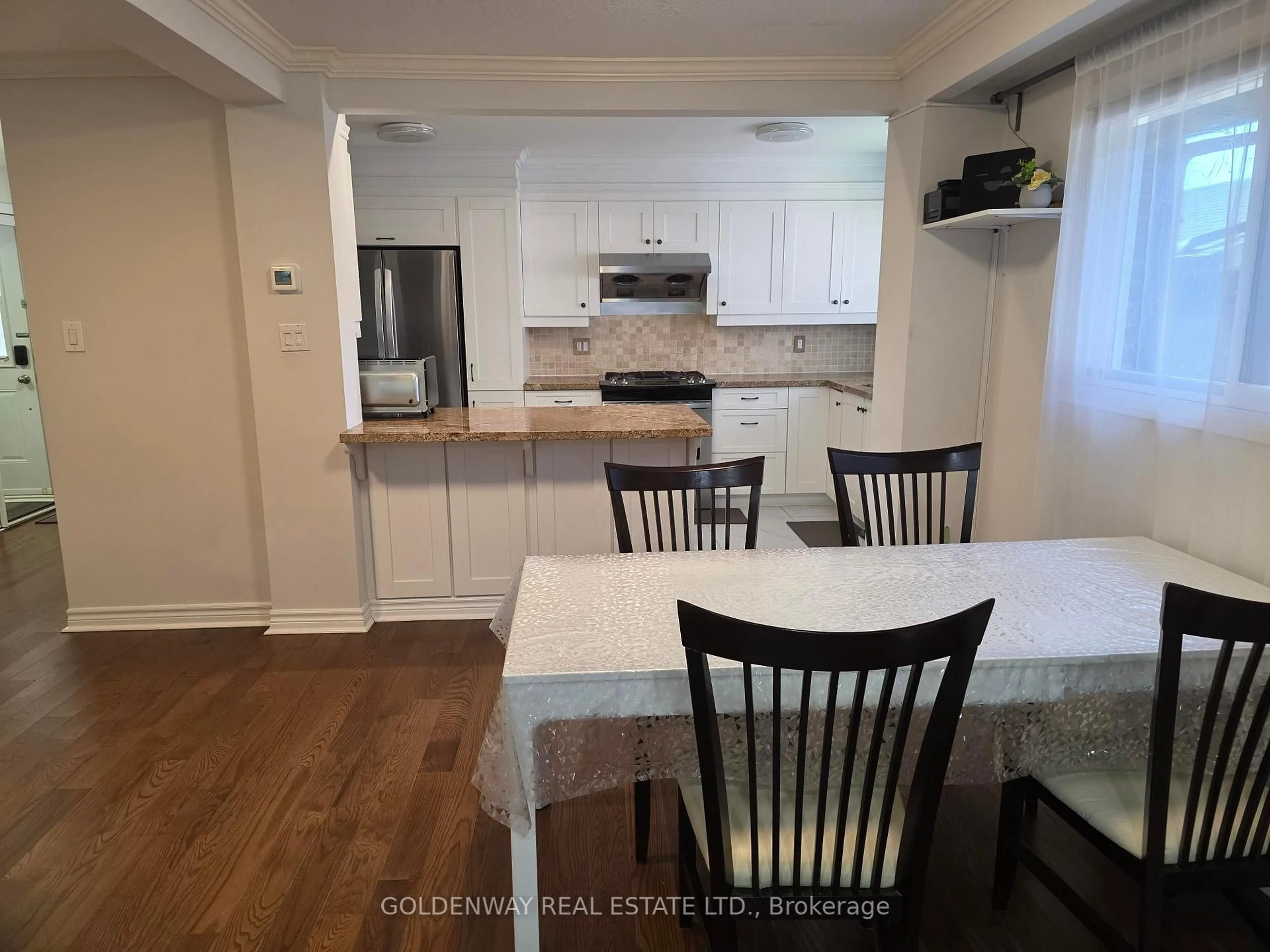 Open concept kitchen, wood/laminate floor for 129 Major Buttons Dr, Markham Ontario L3P 3X7