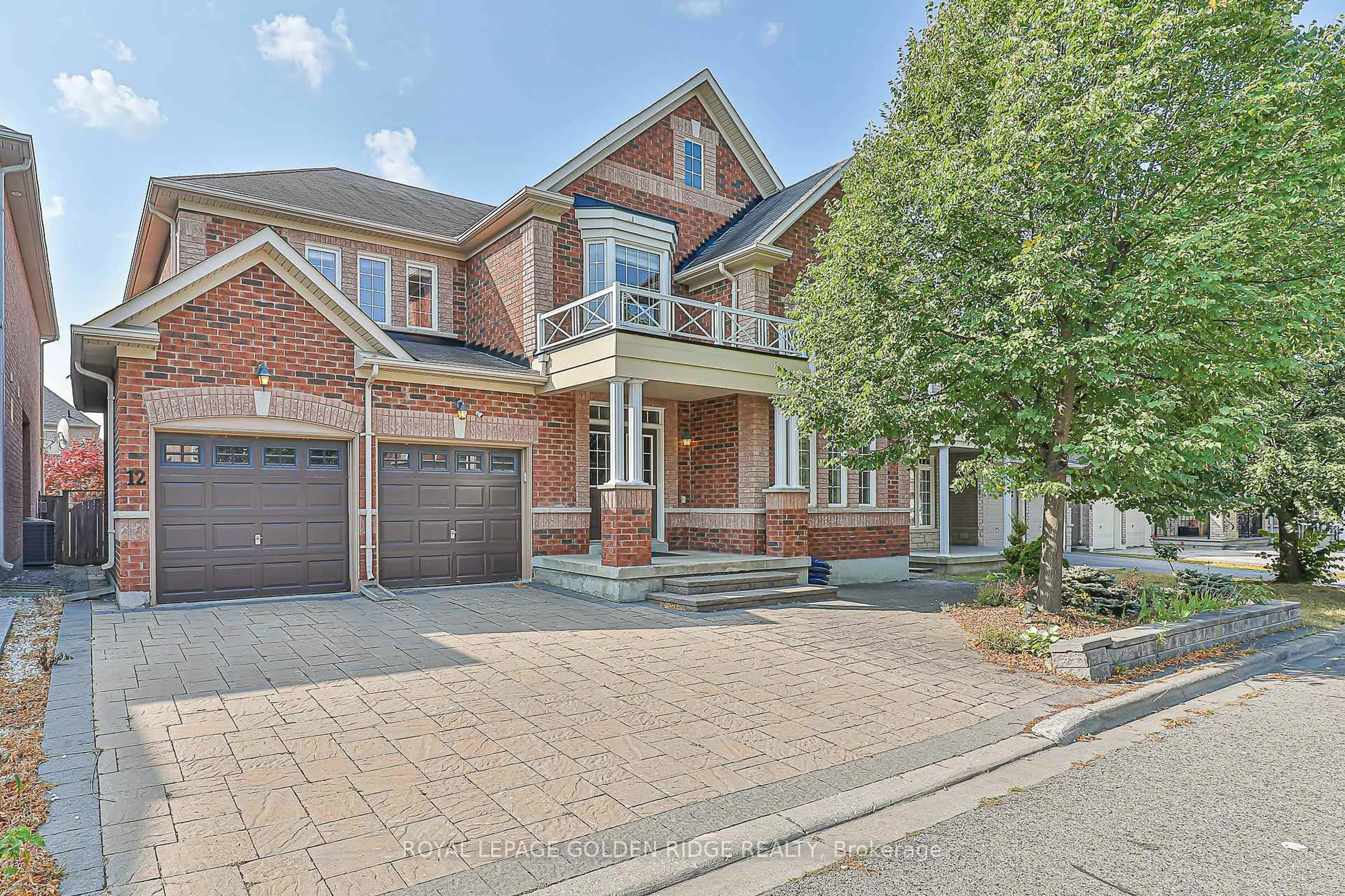 Home with brick exterior material, street for 12 Golden Meadow Dr, Markham Ontario L6E 1V8
