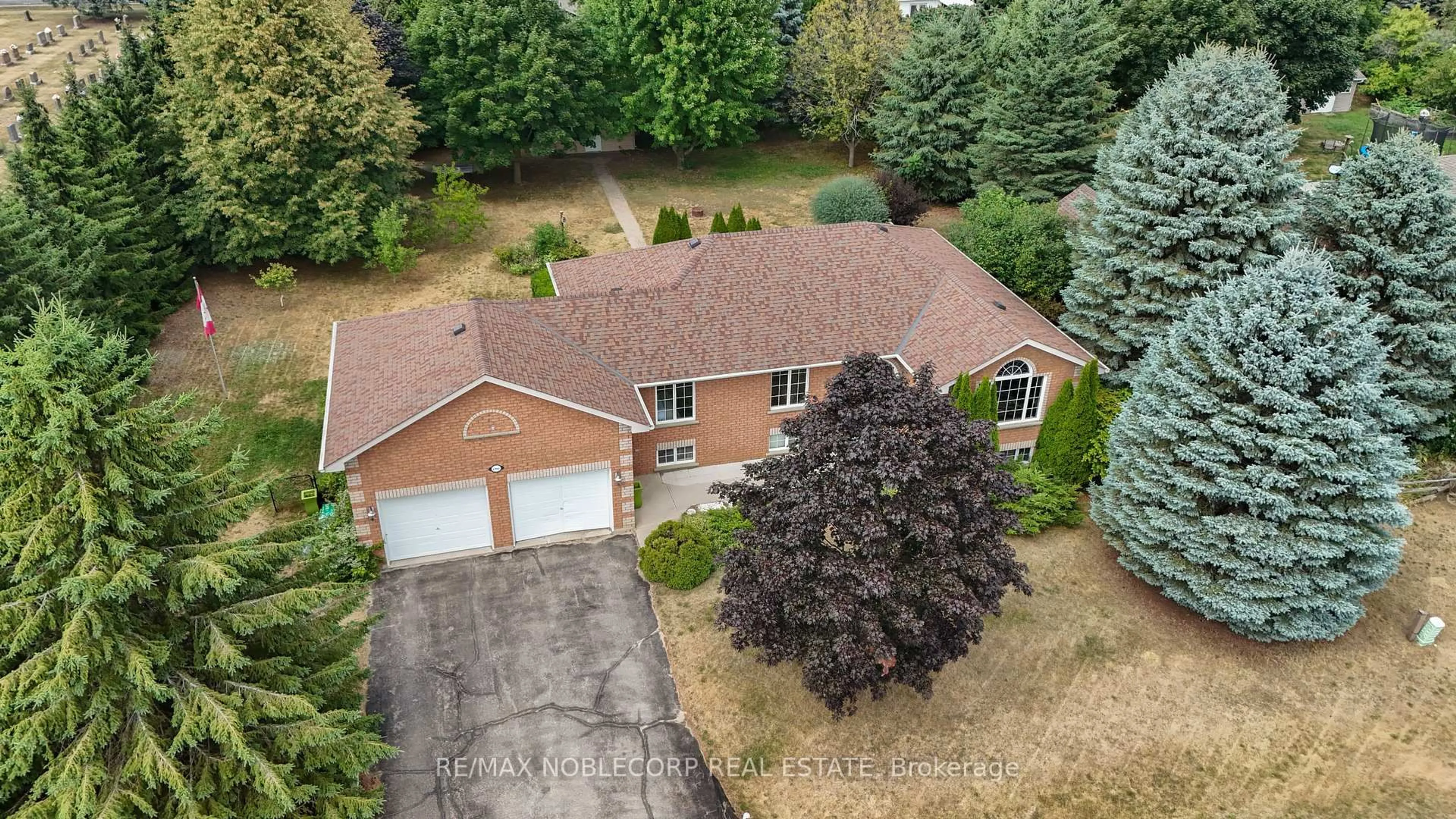 A pic from outside/outdoor area/front of a property/back of a property/a pic from drone, street for 1 Dekker St, Adjala-Tosorontio Ontario L0M 1J0