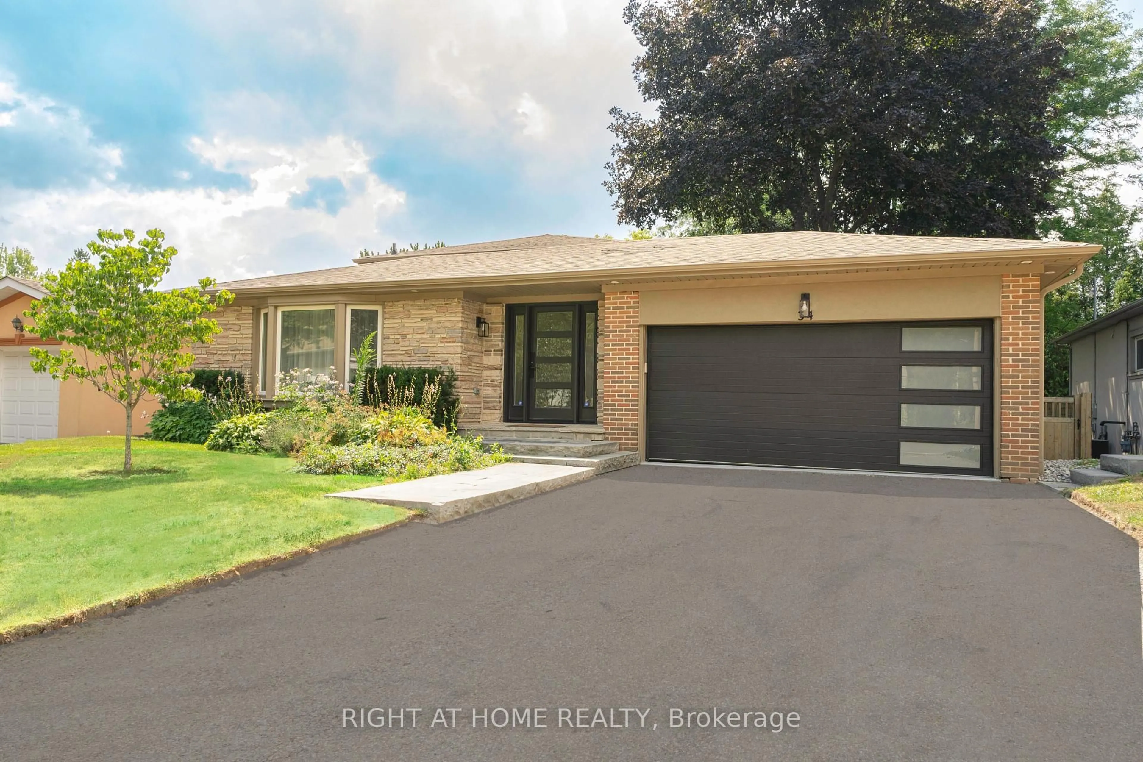 Home with brick exterior material, street for 34 Wildrose Cres, Markham Ontario L3T 1N5