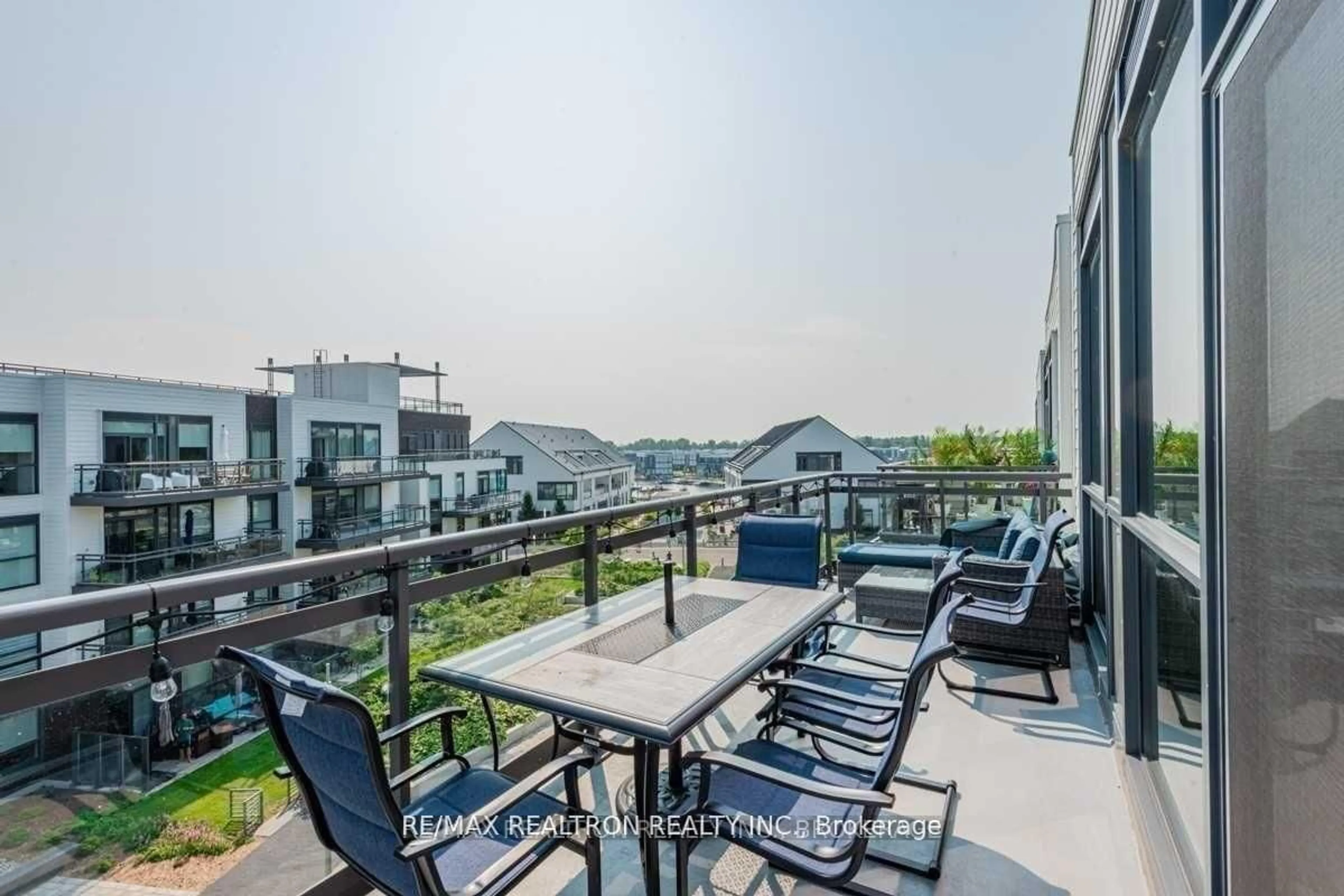 Patio, city buildings view from balcony for 333 Sea Ray Ave #D407, Innisfil Ontario L9S 0M3