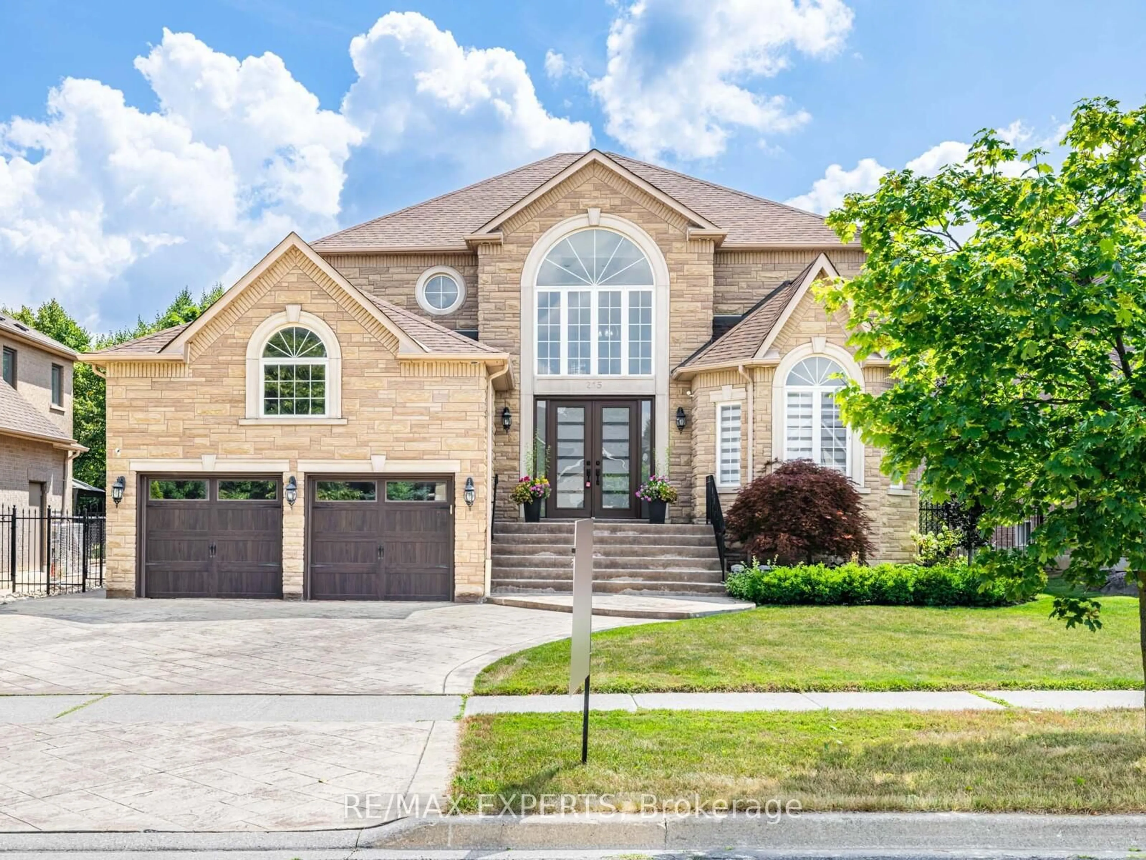 Home with brick exterior material, street for 215 Thomson Creek Blvd, Vaughan Ontario L4H 1H1