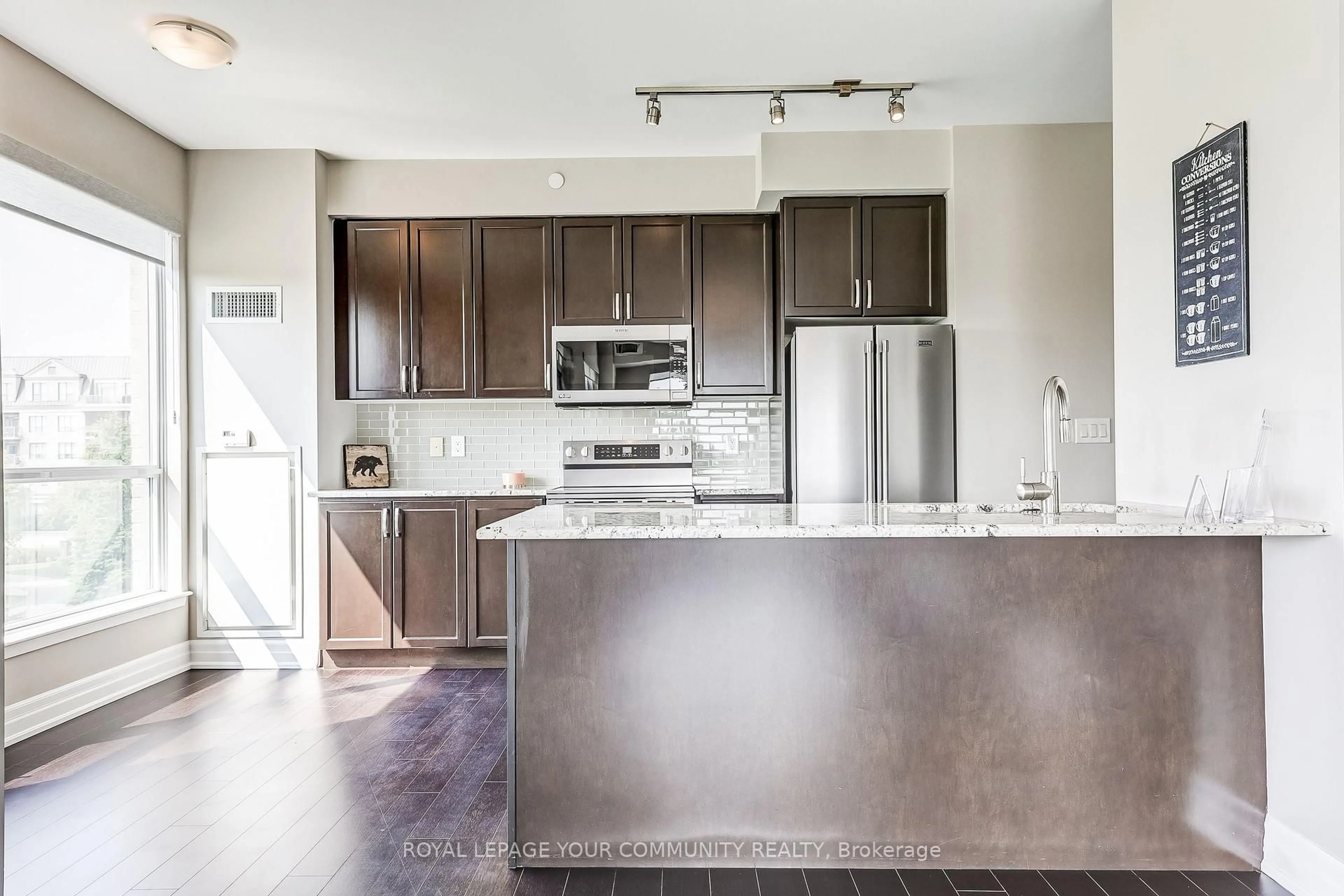 Open concept kitchen, unknown for 111 Civic Square Gate #306, Aurora Ontario L4G 0S6