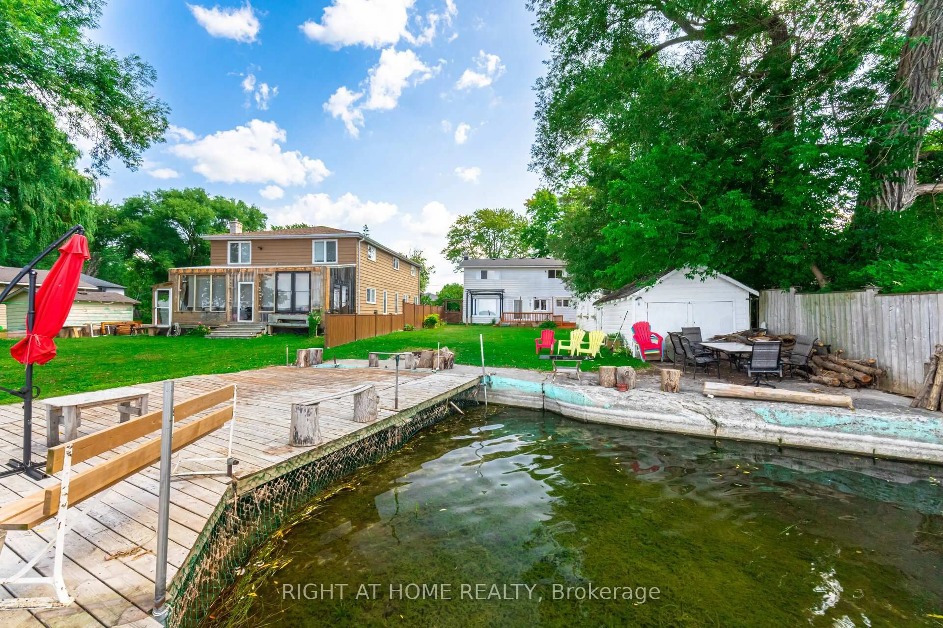 A pic from outside/outdoor area/front of a property/back of a property/a pic from drone, water/lake/river/ocean view for 428 Lake Dr, Georgina Ontario L4P 1P5