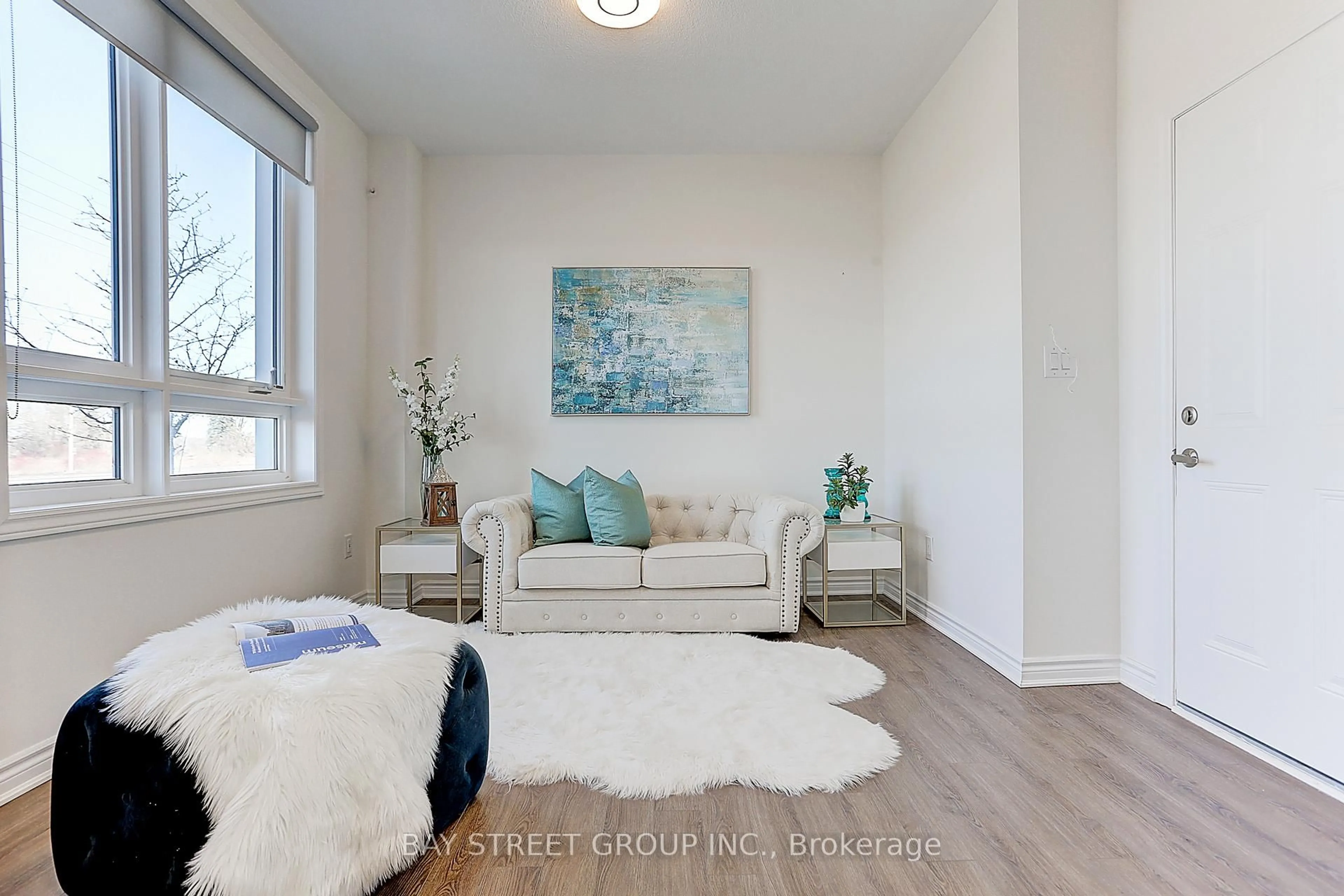 Living room with furniture, wood/laminate floor for 12 Chicago Lane, Markham Ontario L6E 0V6