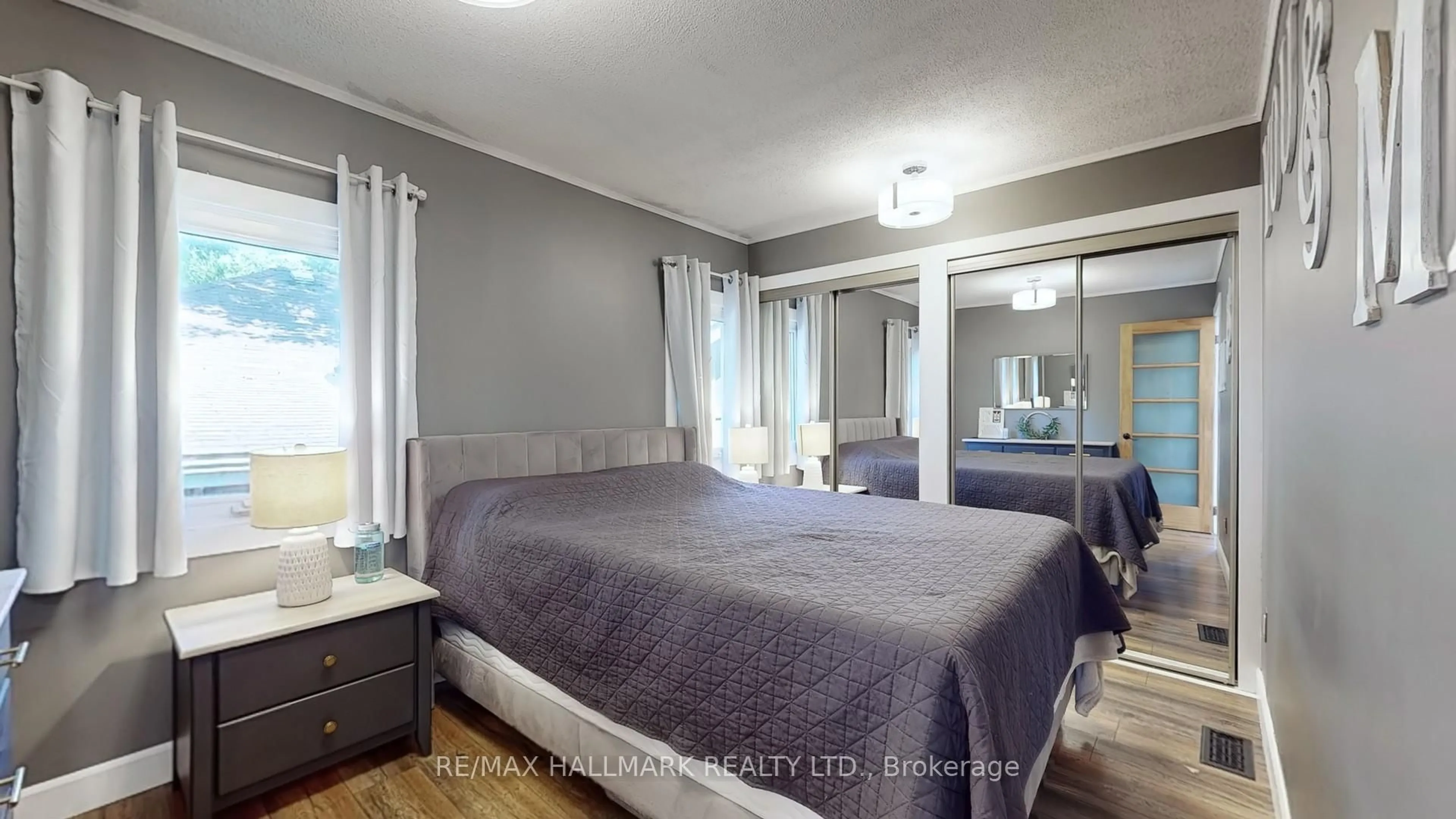 Bedroom with bed, wood/laminate floor for 52 Windsor Dr, Whitchurch-Stouffville Ontario L4A 7X3