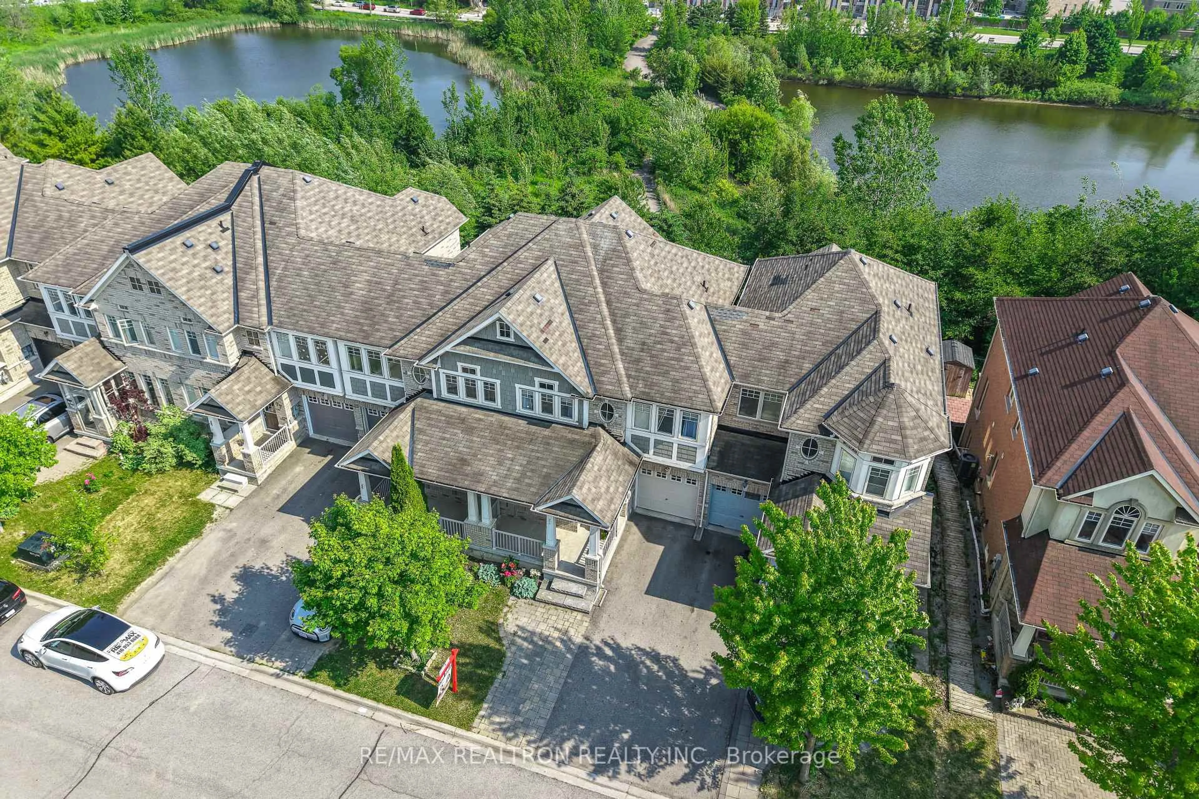 A pic from outside/outdoor area/front of a property/back of a property/a pic from drone, water/lake/river/ocean view for 73 Shirrick Dr, Richmond Hill Ontario L4E 0B6