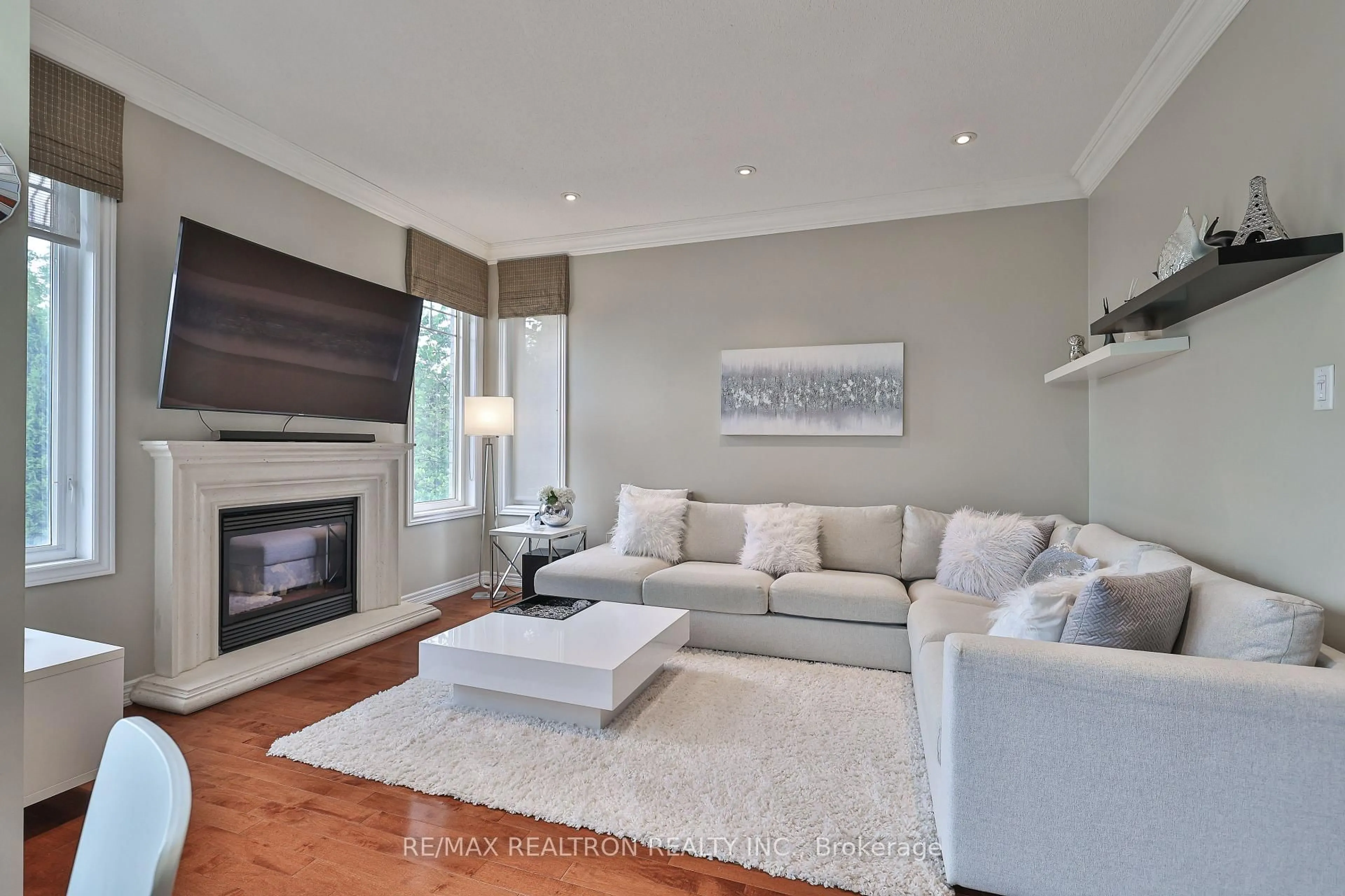 Living room with furniture, wood/laminate floor for 73 Shirrick Dr, Richmond Hill Ontario L4E 0B6