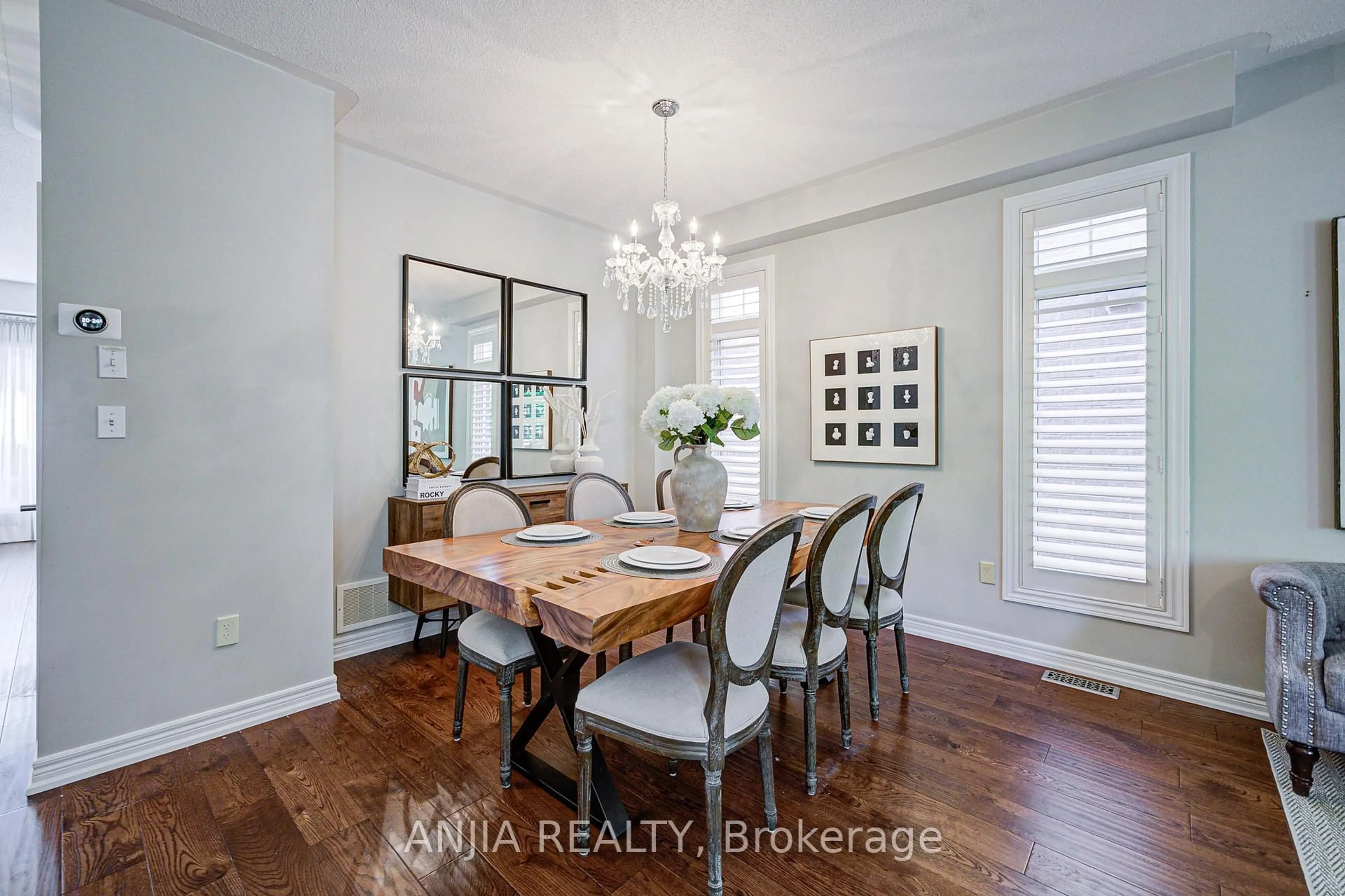 Dining room, wood/laminate floor for 54 Rainbow Valley Cres, Markham Ontario L6E 1Z1