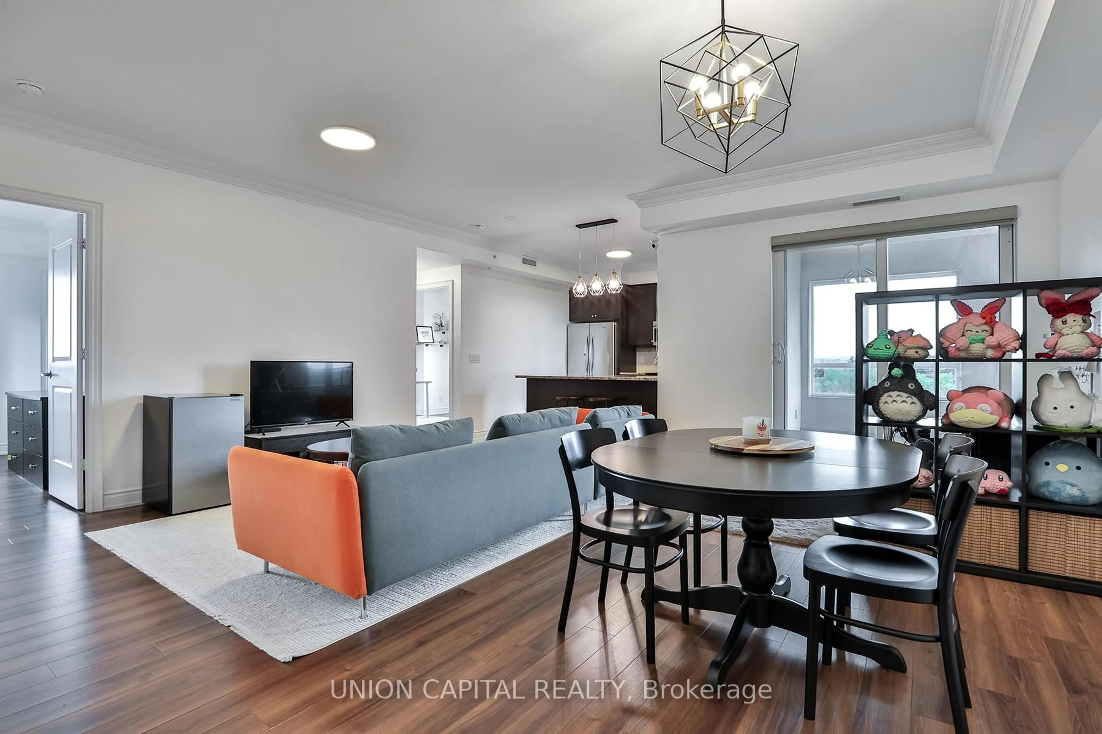 Living room with furniture, wood/laminate floor for 9255 Jane St #605, Vaughan Ontario L6A 0K1
