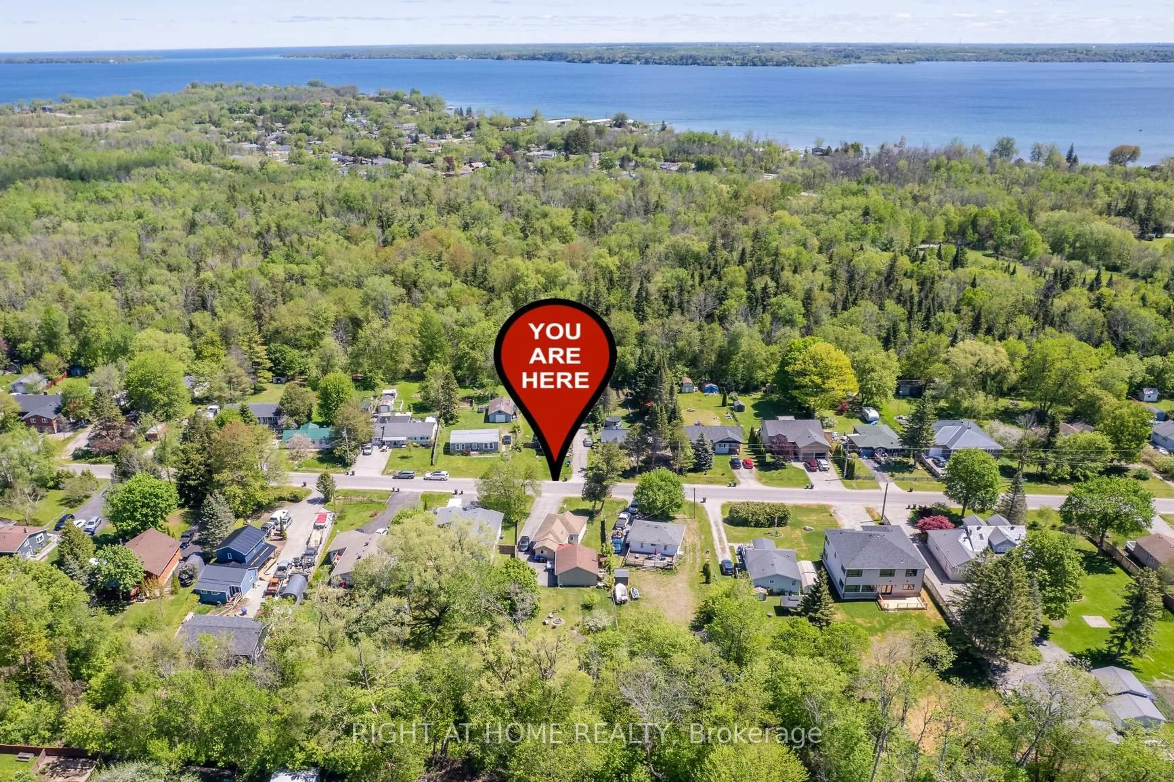 A pic from outside/outdoor area/front of a property/back of a property/a pic from drone, water/lake/river/ocean view for 1024 Ferrier Ave, Innisfil Ontario L0L 1W0