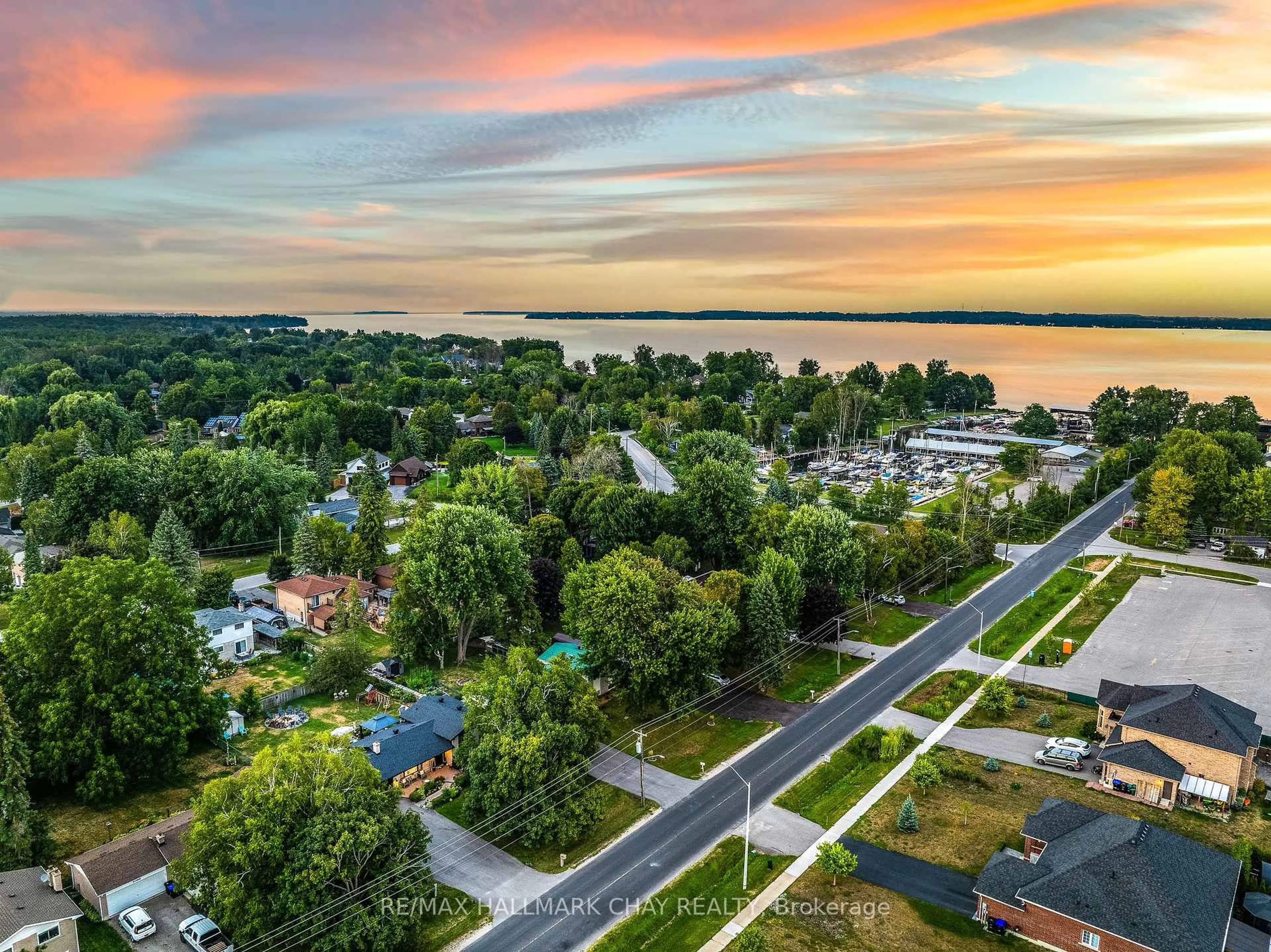 A pic from outside/outdoor area/front of a property/back of a property/a pic from drone, water/lake/river/ocean view for 1180 Shore Acres Dr, Innisfil Ontario L0L 1R0
