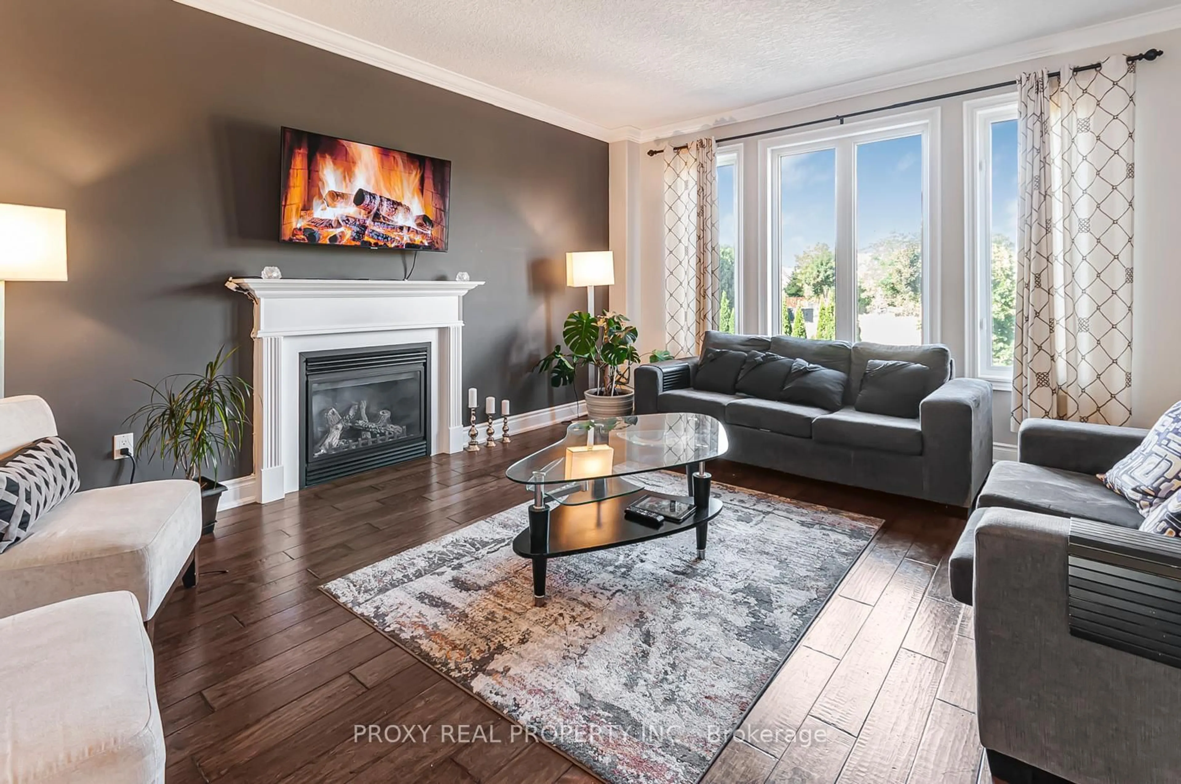 Living room with furniture, wood/laminate floor for 996 BOOTH Ave, Innisfil Ontario L9S 0A4