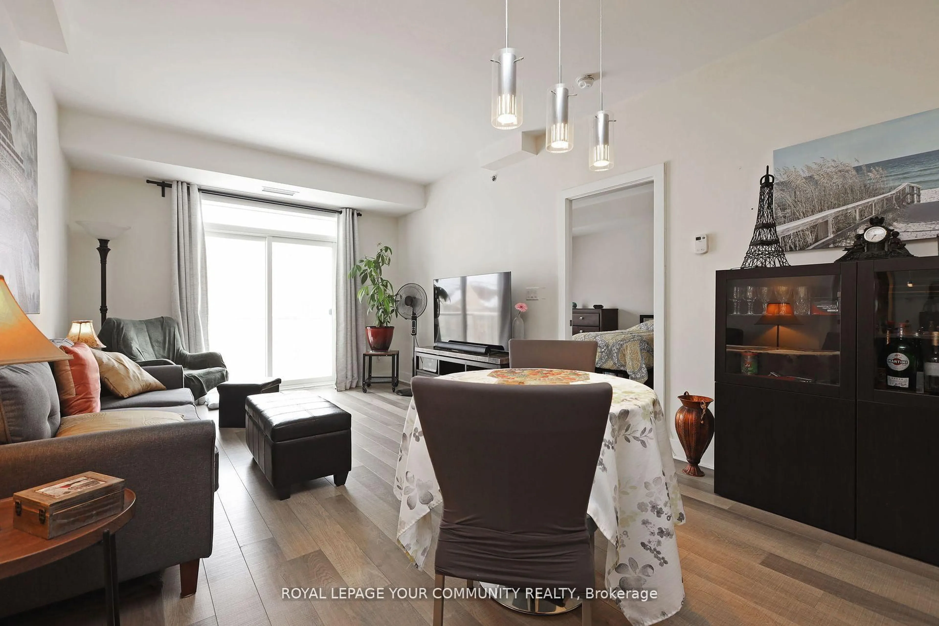 Living room with furniture, wood/laminate floor for 28 Prince Regent St #320, Markham Ontario L6C 0V5