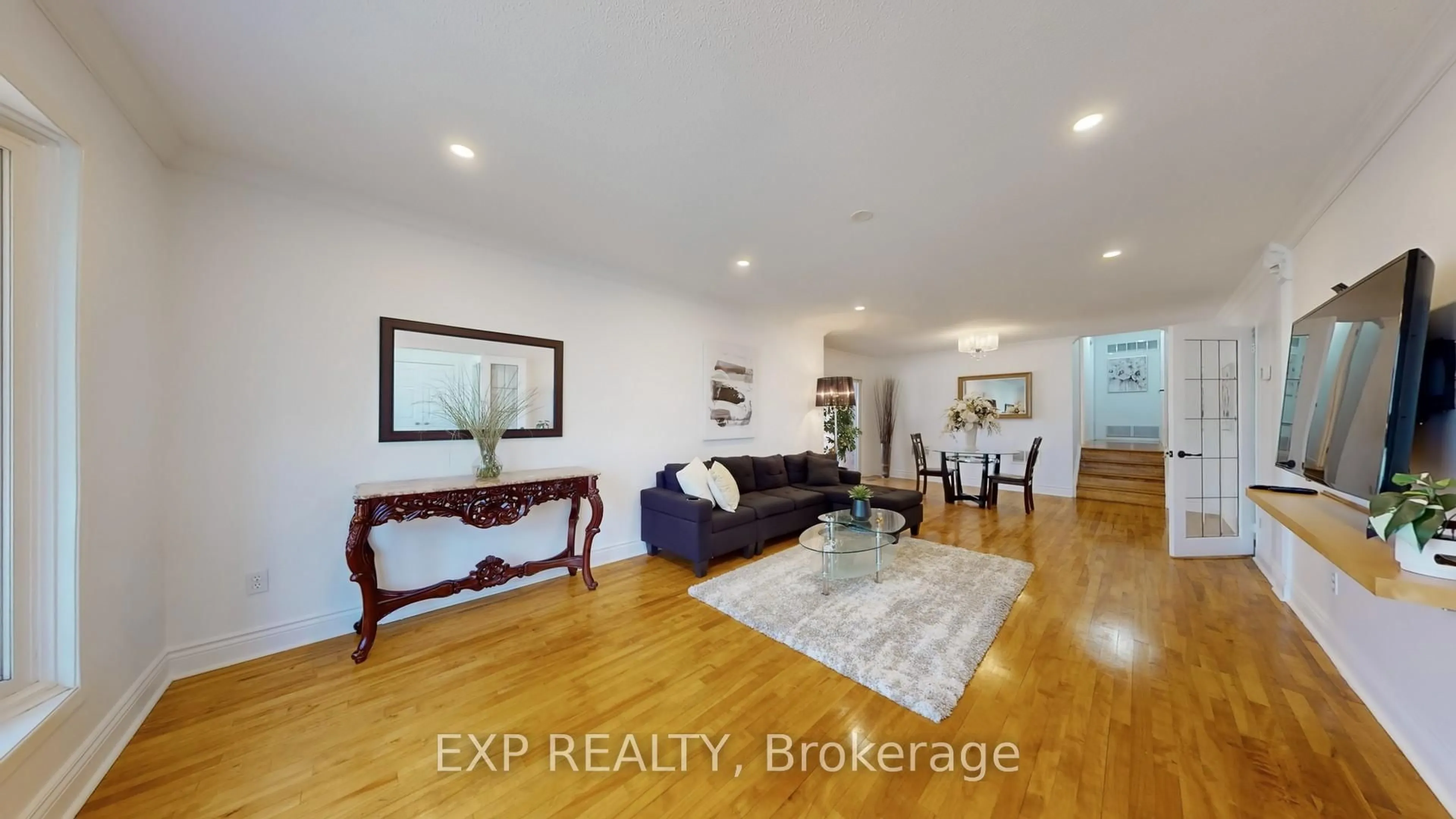 Living room with furniture, wood/laminate floor for 65 Lowe Blvd, Newmarket Ontario L3Y 6H1