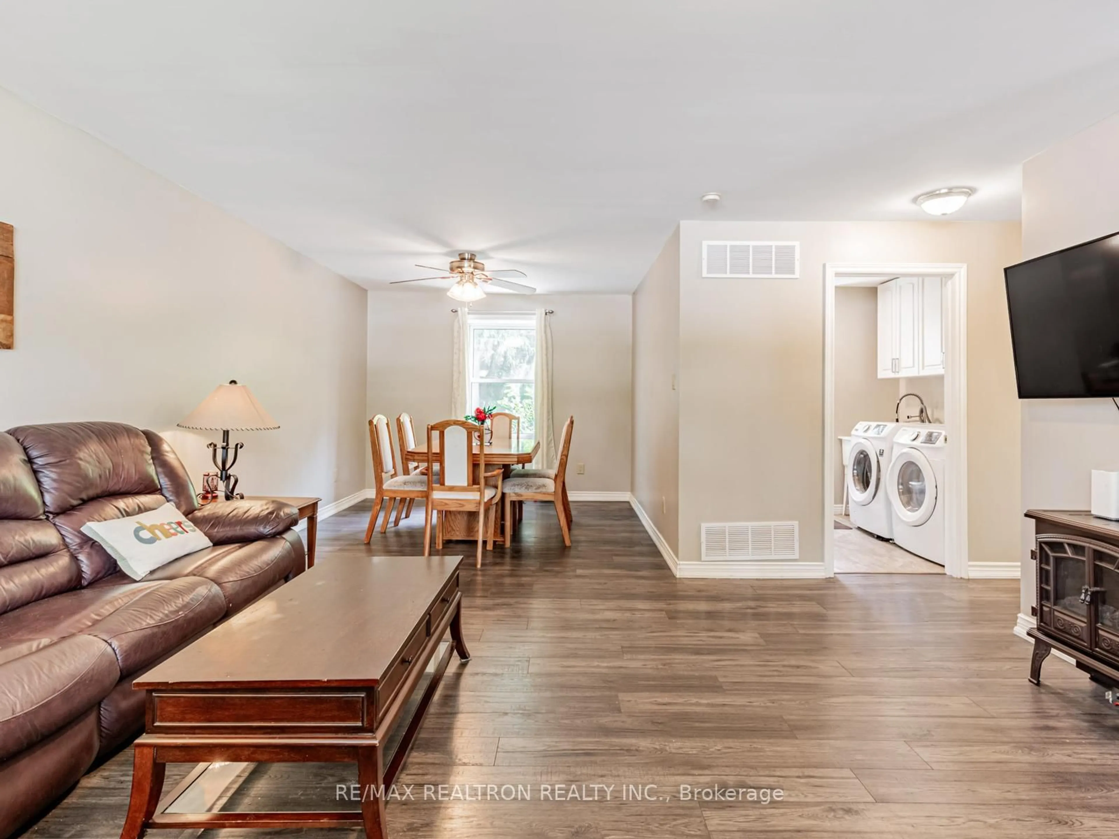 Living room with furniture, wood/laminate floor for 337 Simcoe Rd, Bradford West Gwillimbury Ontario L3Z 1Z1