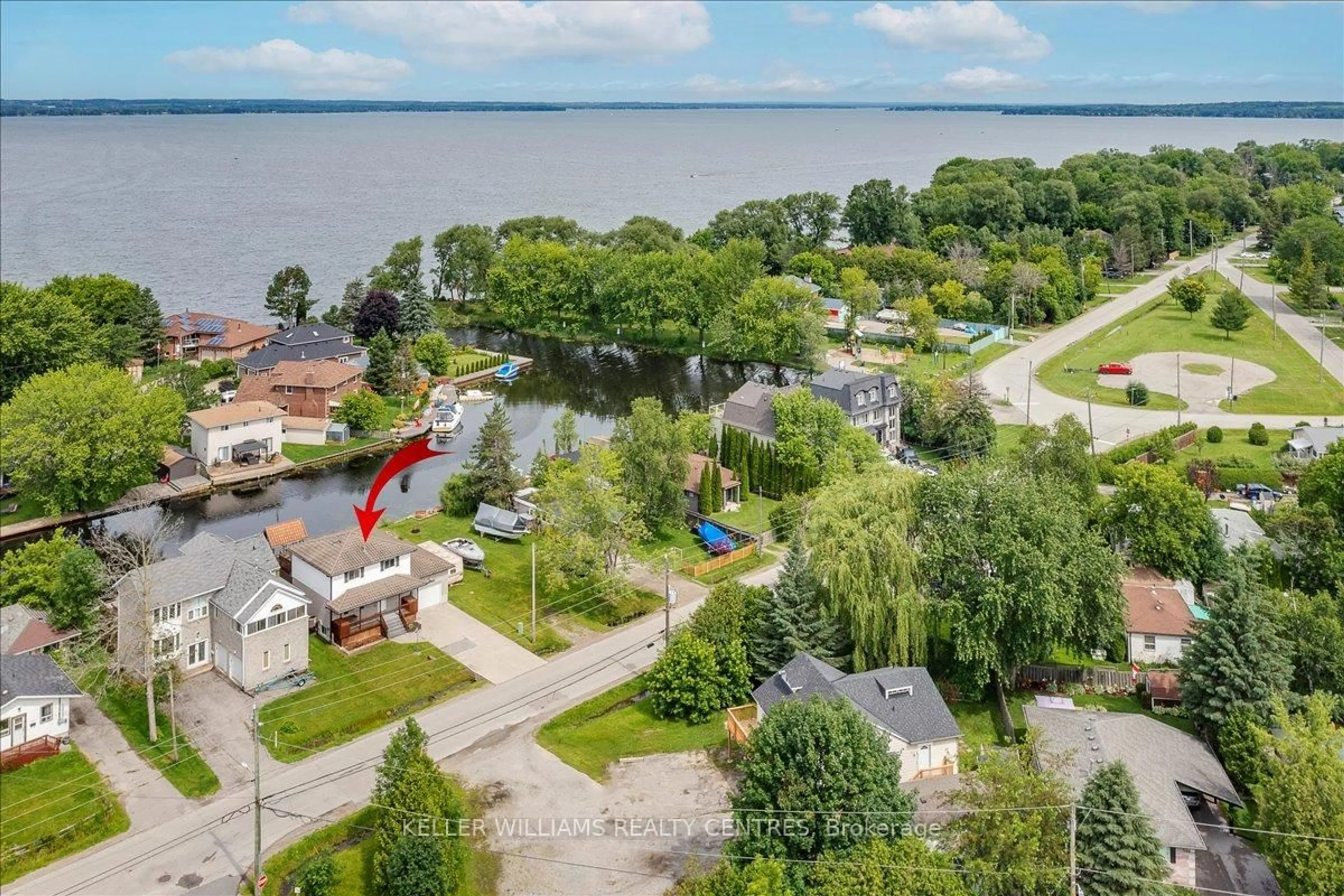 A pic from outside/outdoor area/front of a property/back of a property/a pic from drone, water/lake/river/ocean view for 612 Lake Dr, Georgina Ontario L4P 1T5