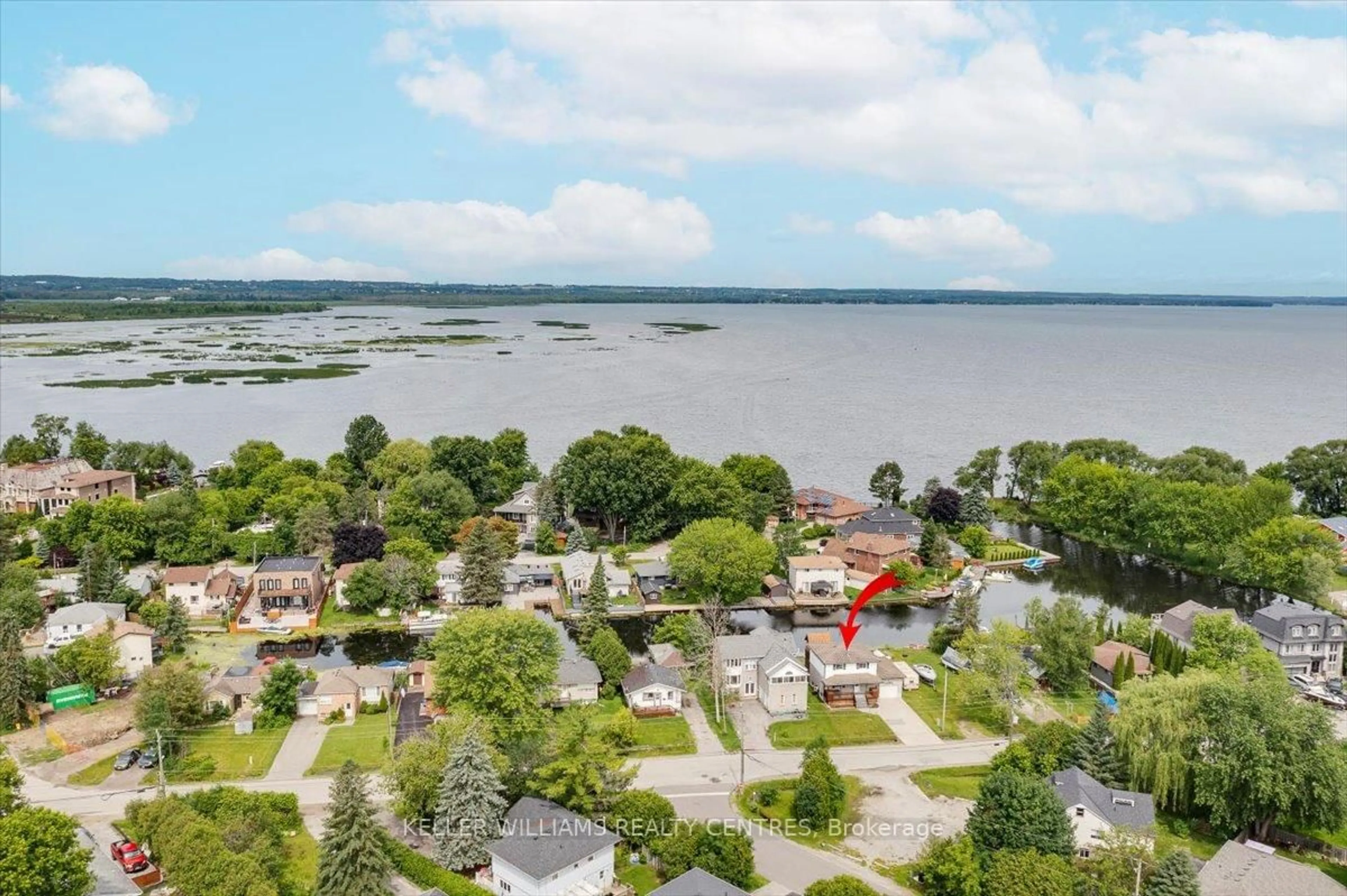 A pic from outside/outdoor area/front of a property/back of a property/a pic from drone, water/lake/river/ocean view for 612 Lake Dr, Georgina Ontario L4P 1T5