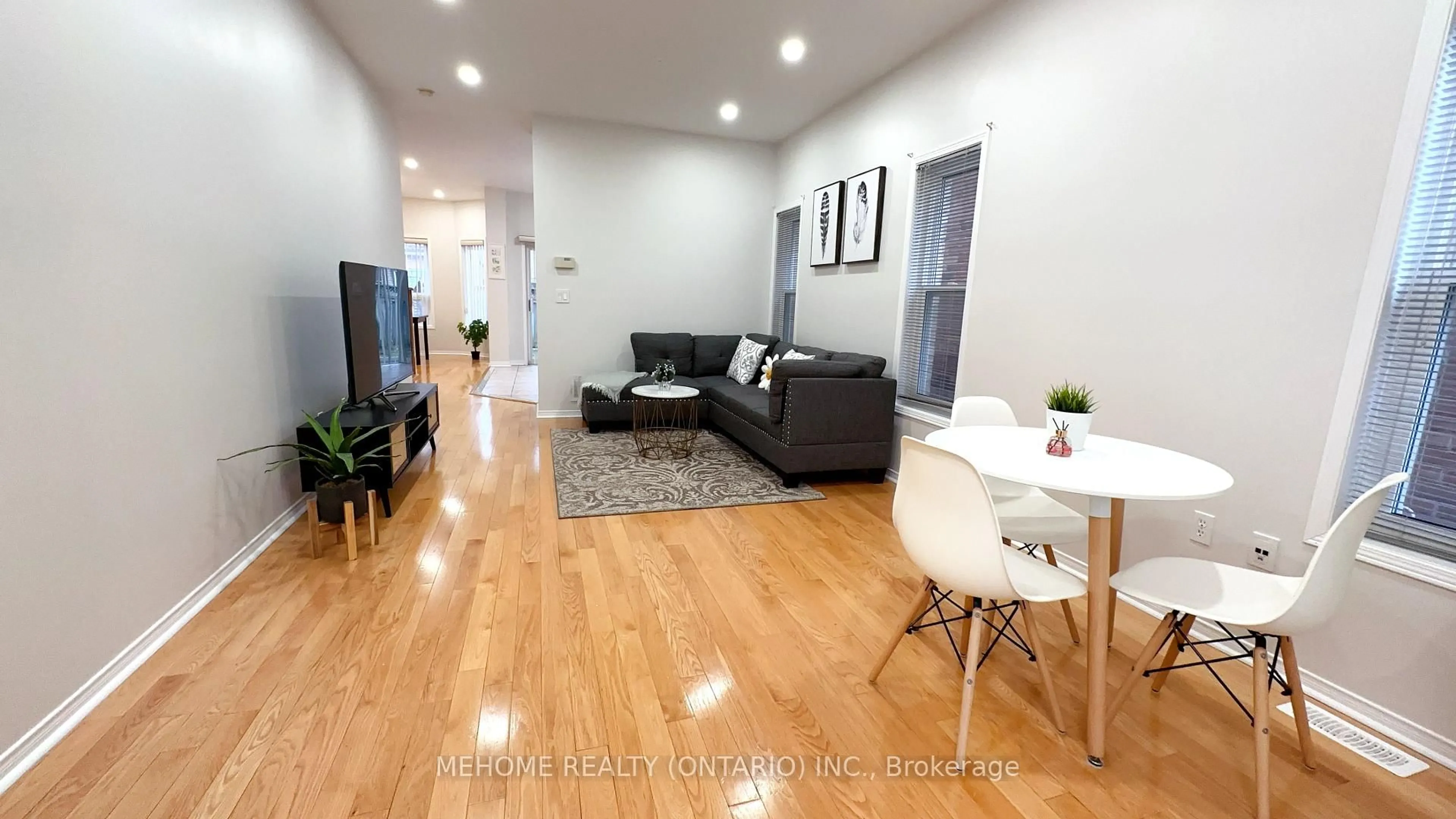 Living room with furniture, wood/laminate floor for 15 Catherina St, Markham Ontario L6C 2L6