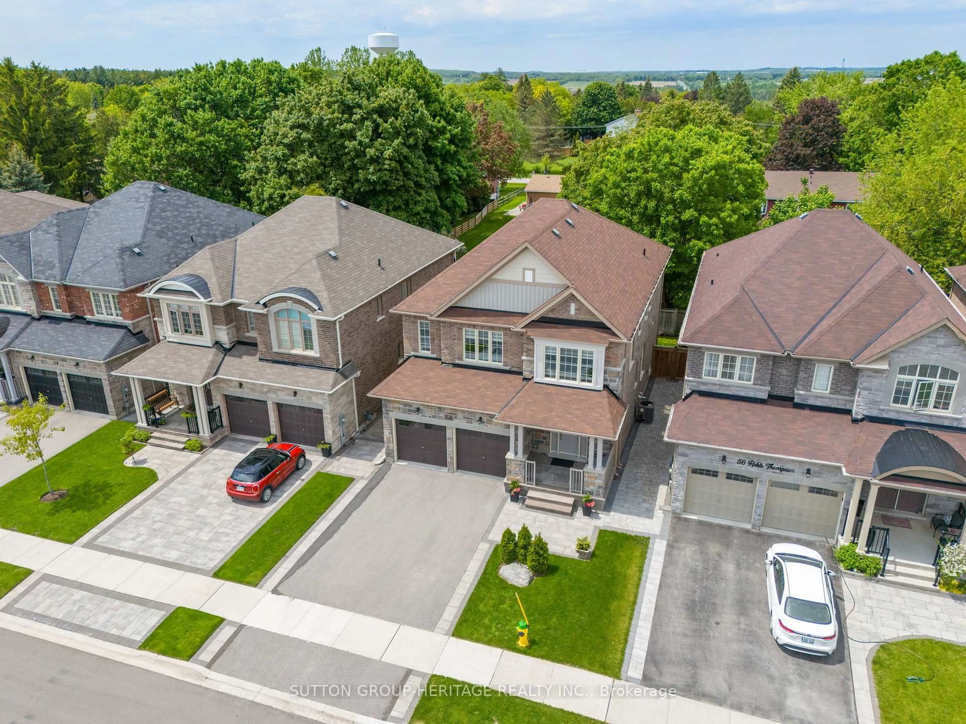 A pic from outside/outdoor area/front of a property/back of a property/a pic from drone, street for 54 Robb Thompson Rd, East Gwillimbury Ontario L0G 1M0