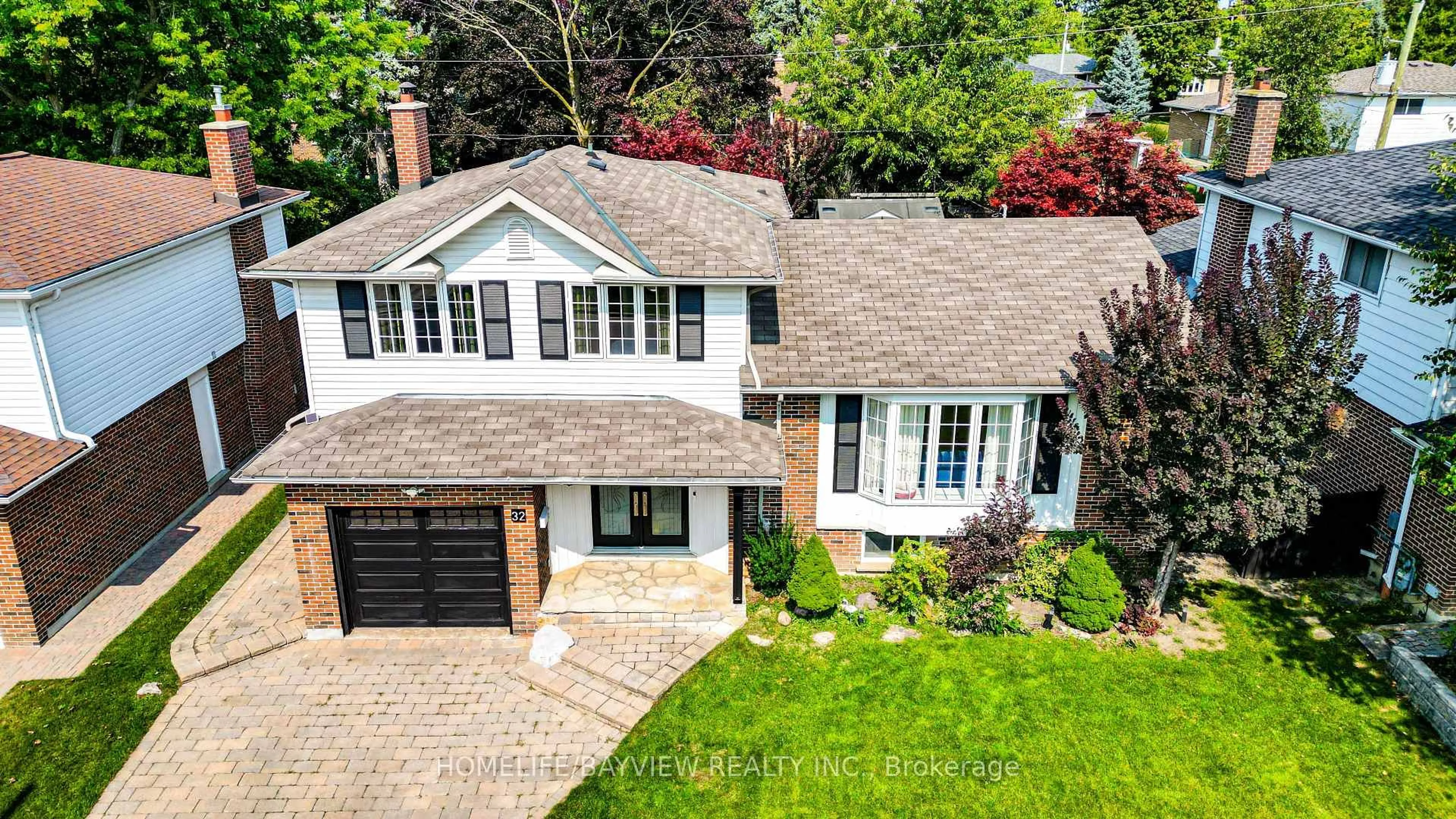 Home with brick exterior material, street for 32 Silver Aspen Dr, Markham Ontario L3T 3T2