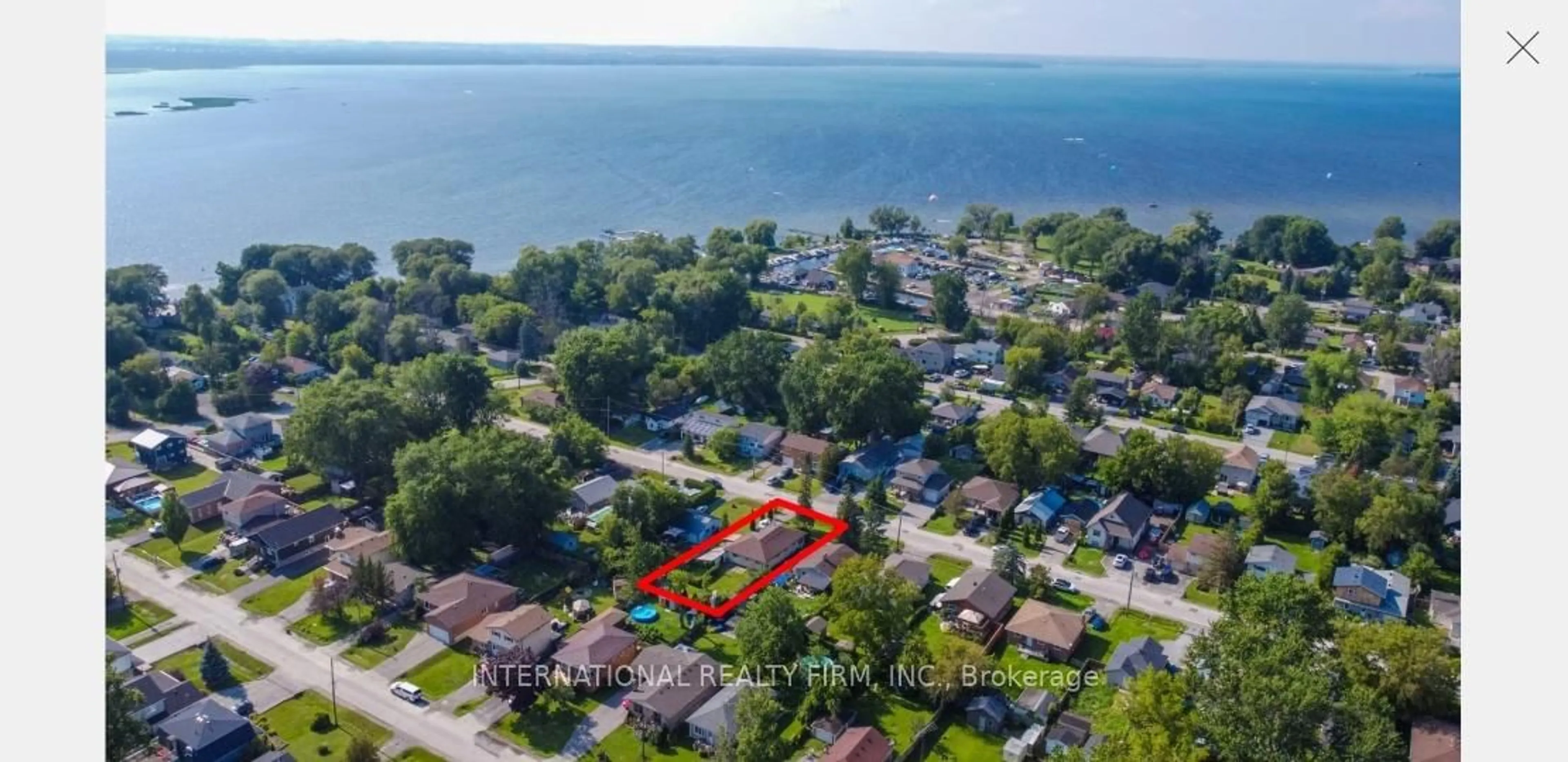 A pic from outside/outdoor area/front of a property/back of a property/a pic from drone, water/lake/river/ocean view for 355 Hollywood Dr, Georgina Ontario L4P 3A2