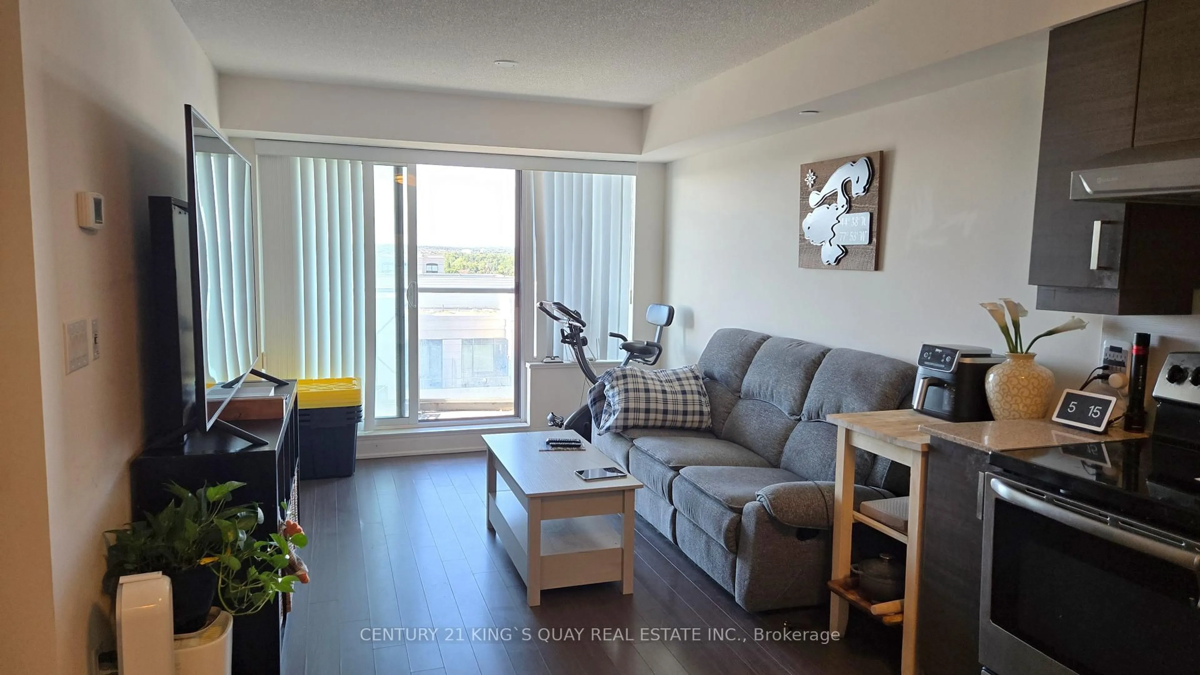 Living room with furniture, wood/laminate floor for 1 Uptown Dr #1208, Markham Ontario L3R 5C1