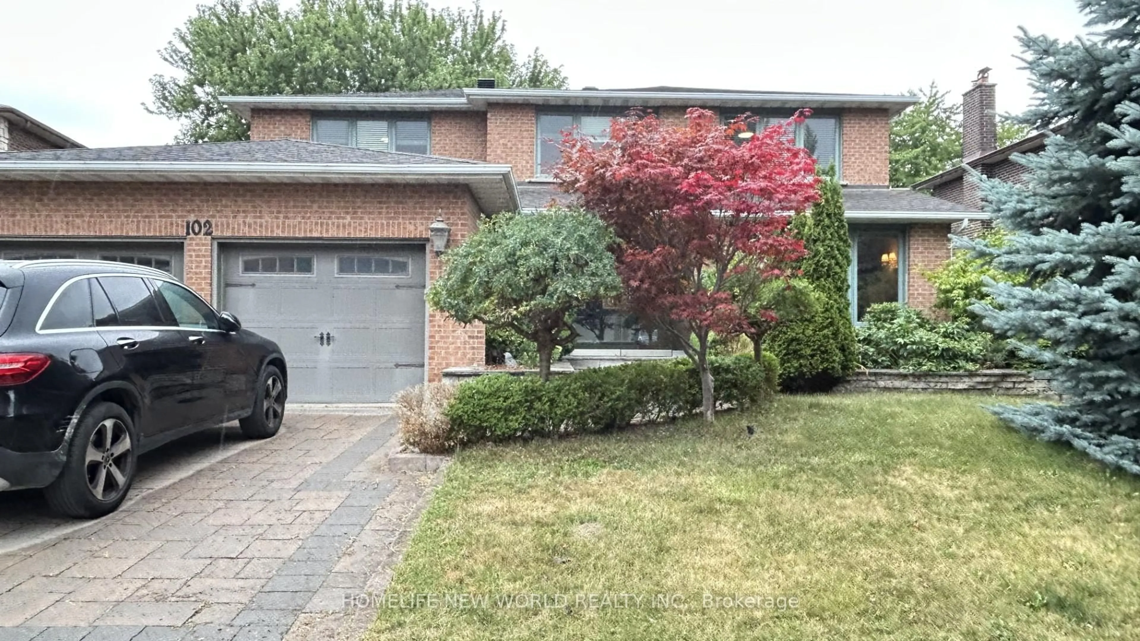 Home with brick exterior material, street for 102 Willowbrook Rd, Markham Ontario L3T 5P5