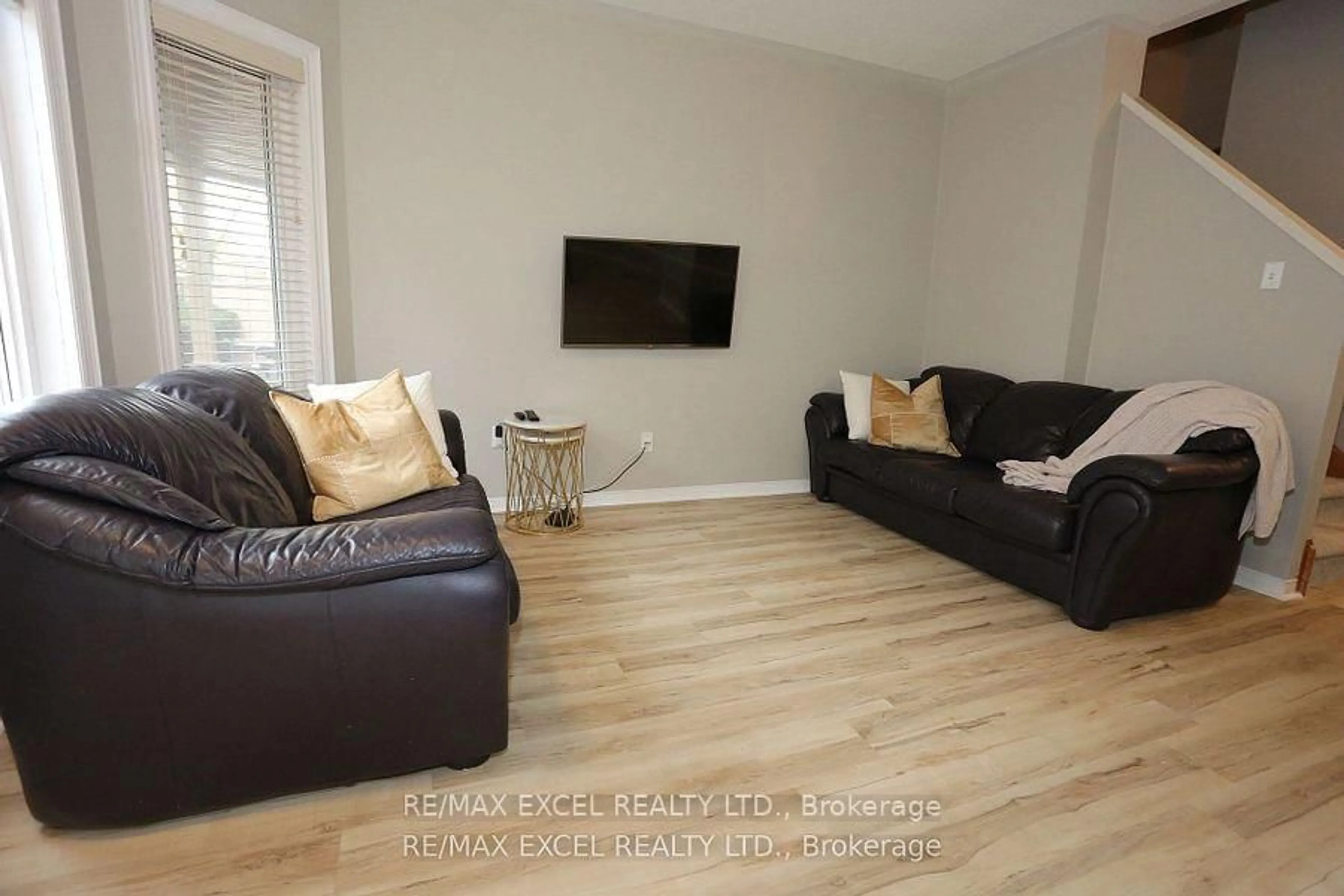 Living room with furniture, wood/laminate floor for 735 New Westminster Dr #37, Vaughan Ontario L4J 7Y9
