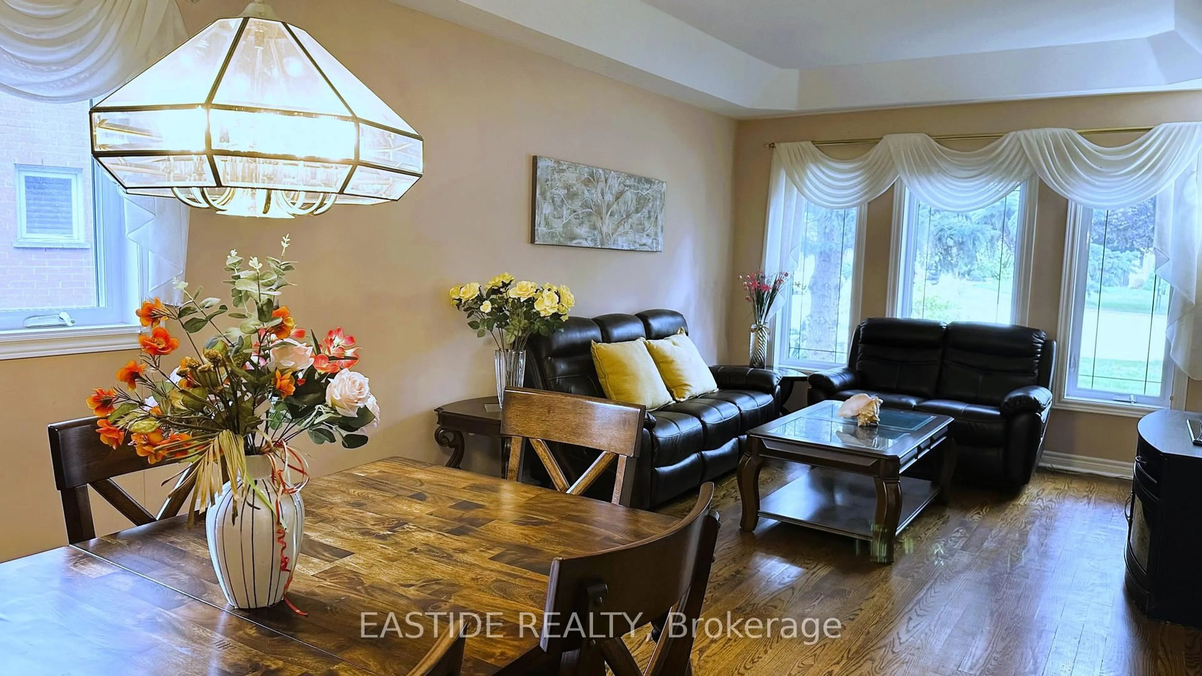 Living room with furniture, wood/laminate floor for 570 Roeder Crt, Newmarket Ontario L3Y 8C2