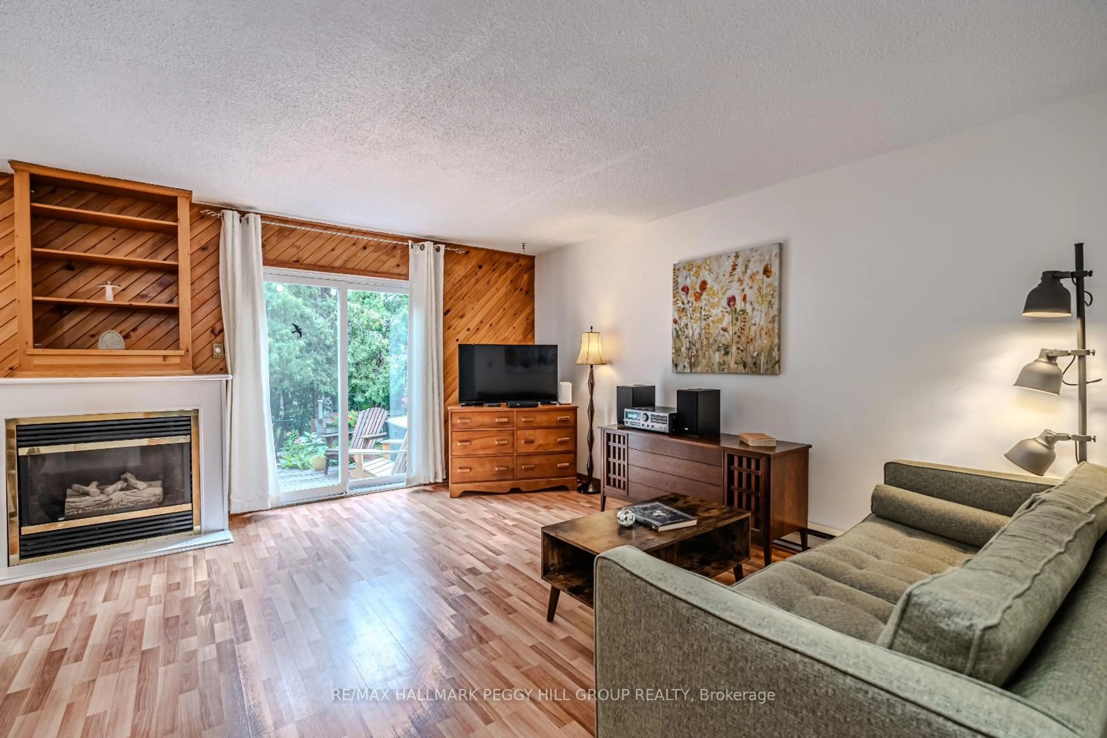 Living room with furniture, wood/laminate floor for 403 Maplegrove Ave, Bradford West Gwillimbury Ontario L3Z 1V8