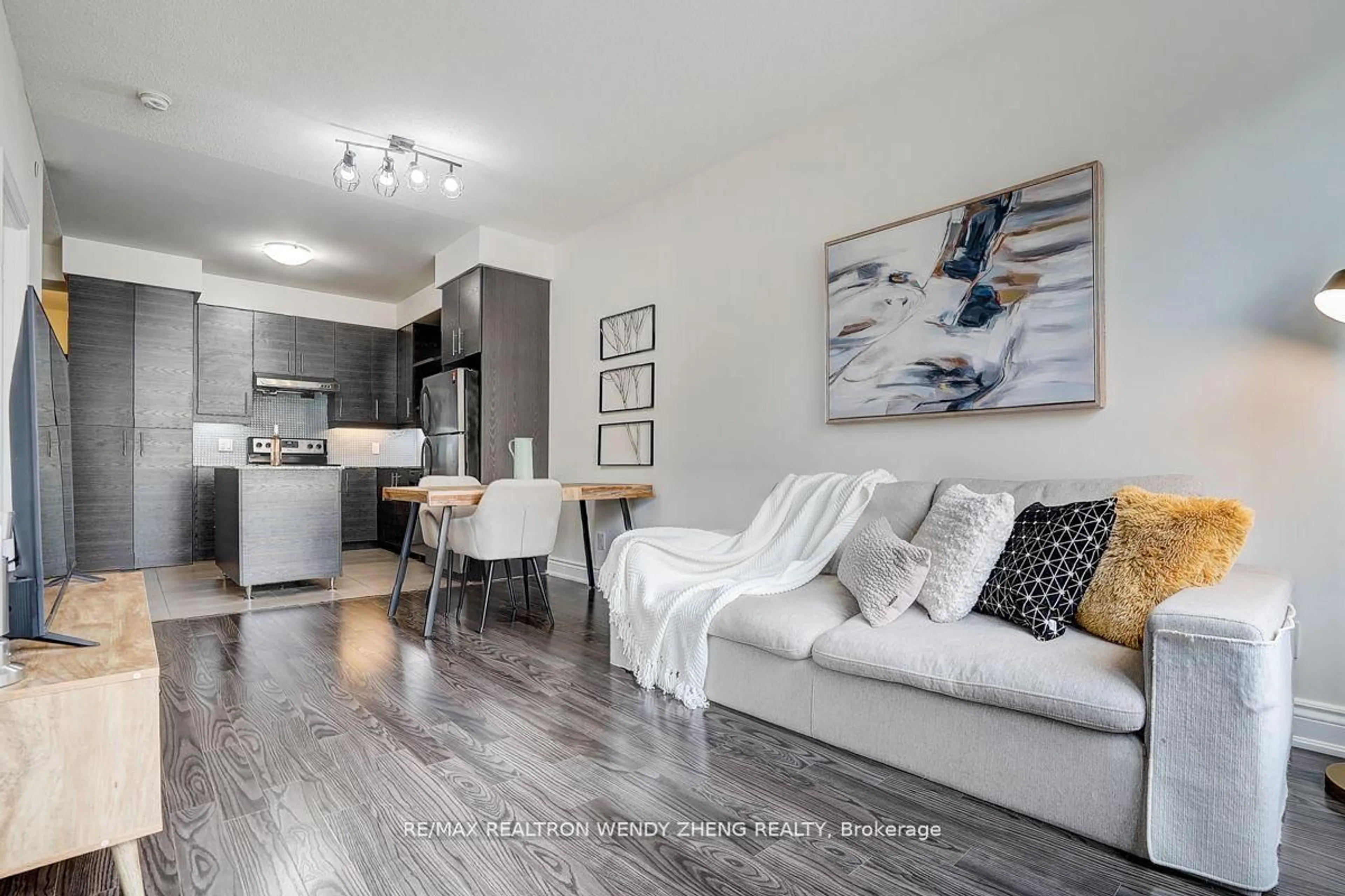 Living room with furniture, wood/laminate floor for 277 South Park Rd #201, Markham Ontario L3T 0B7