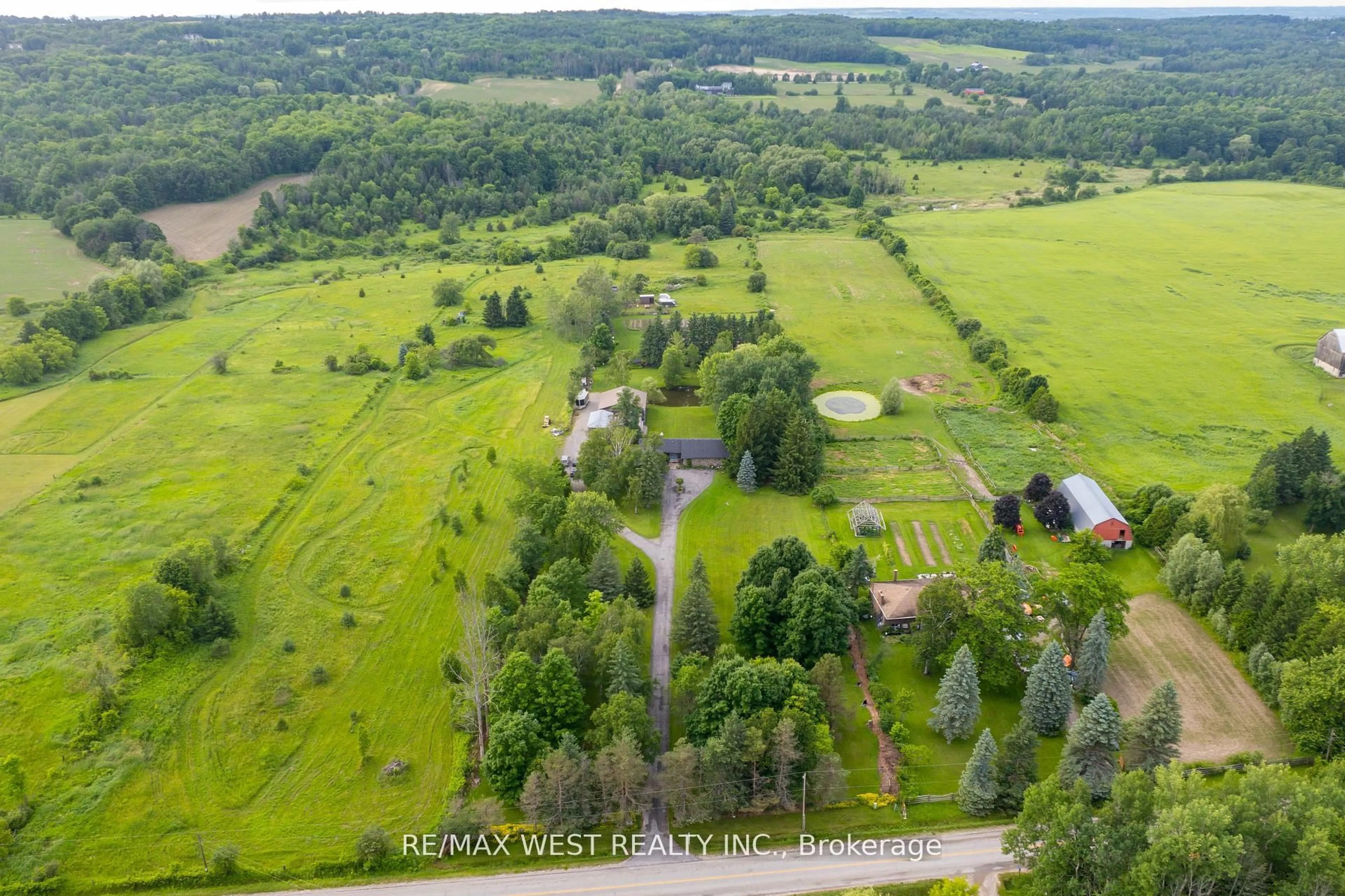 A pic from outside/outdoor area/front of a property/back of a property/a pic from drone, forest/trees view for 5878 4th Line, New Tecumseth Ontario L0G 1W0