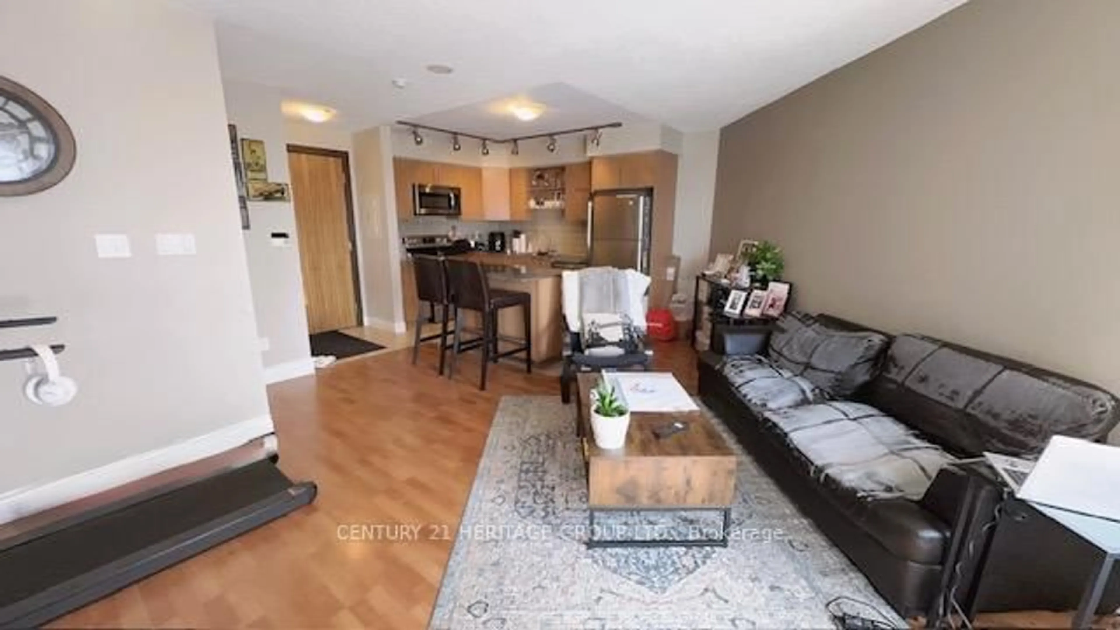 Living room with furniture, wood/laminate floor for 60 South Town Centre Blvd #320, Markham Ontario L6G 0C5