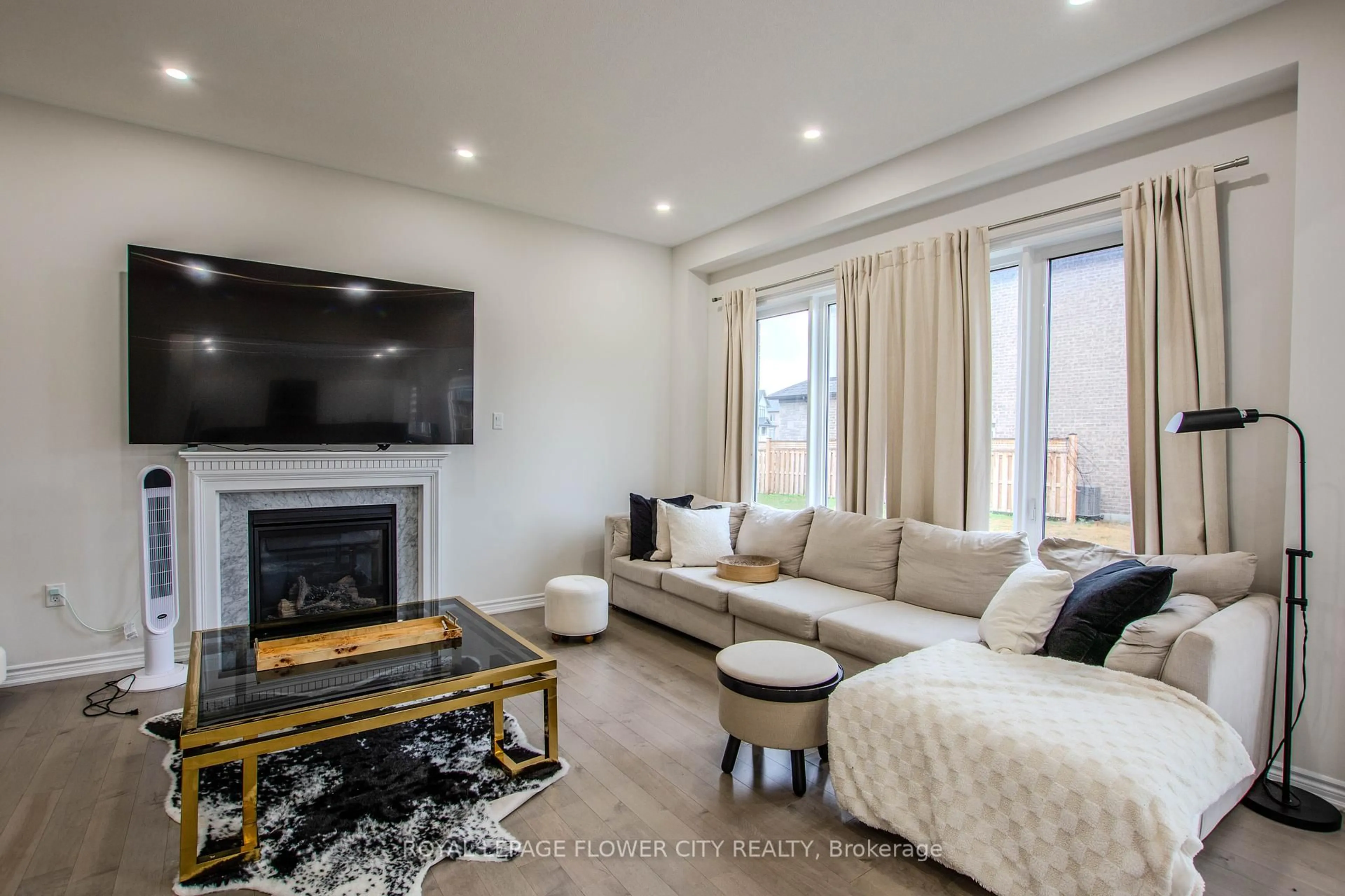 Living room with furniture, wood/laminate floor for 1114 Wickham Rd, Innisfil Ontario L9S 0P8