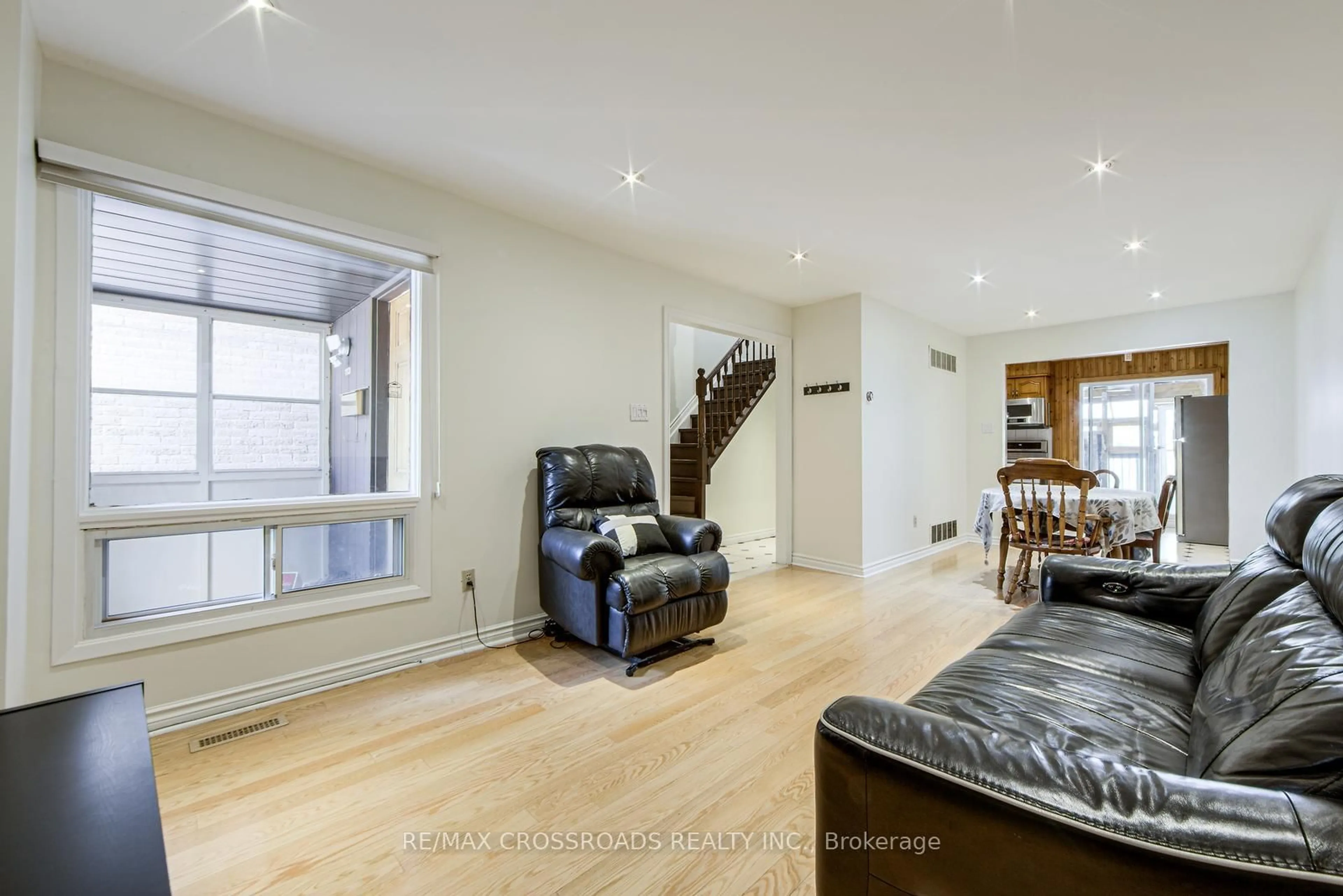 Living room with furniture, wood/laminate floor for 113 Bedale Cres, Markham Ontario L3R 3N9