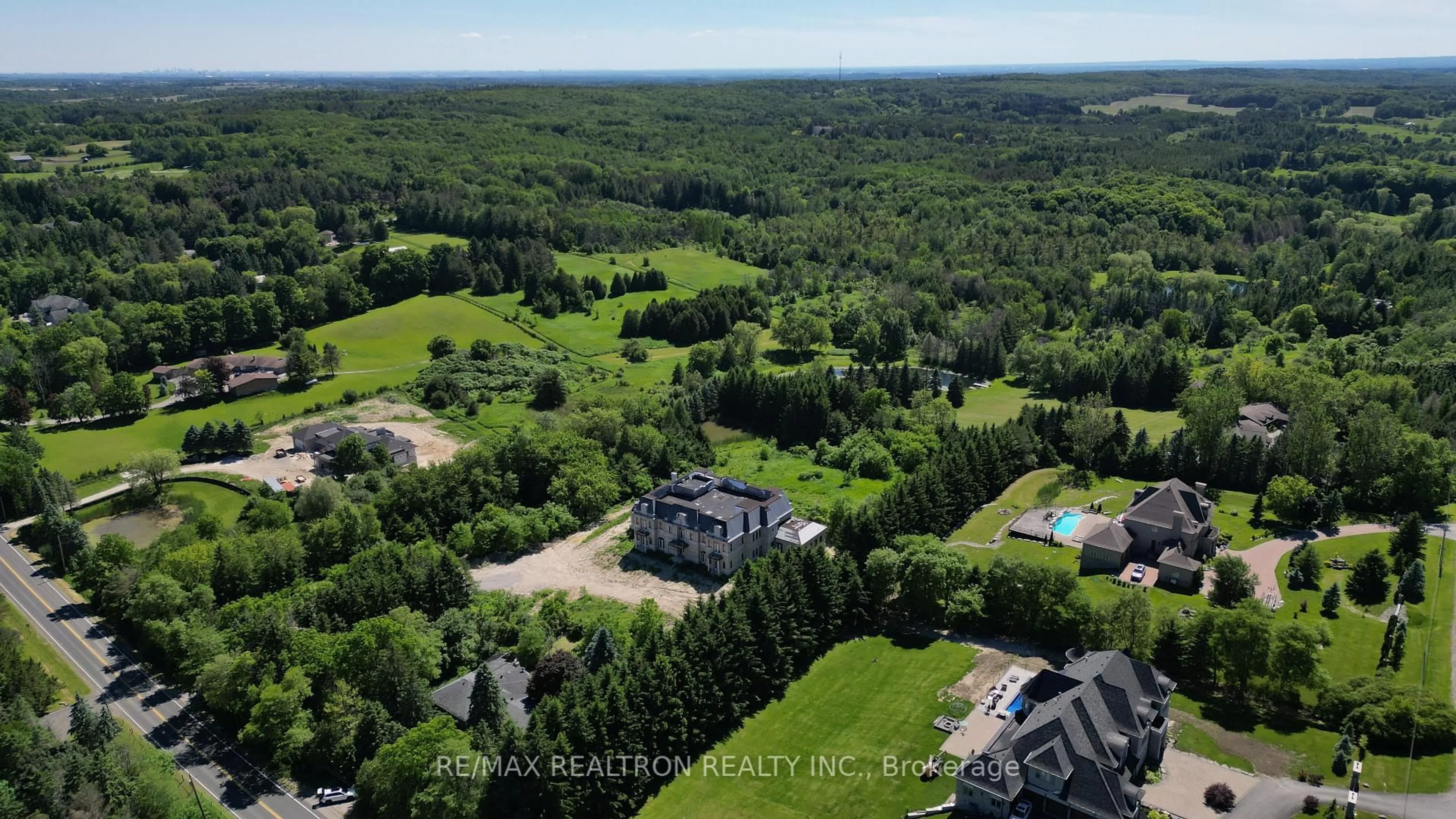 A pic from outside/outdoor area/front of a property/back of a property/a pic from drone, forest/trees view for 15230 Keele St, King Ontario L7B 1A3