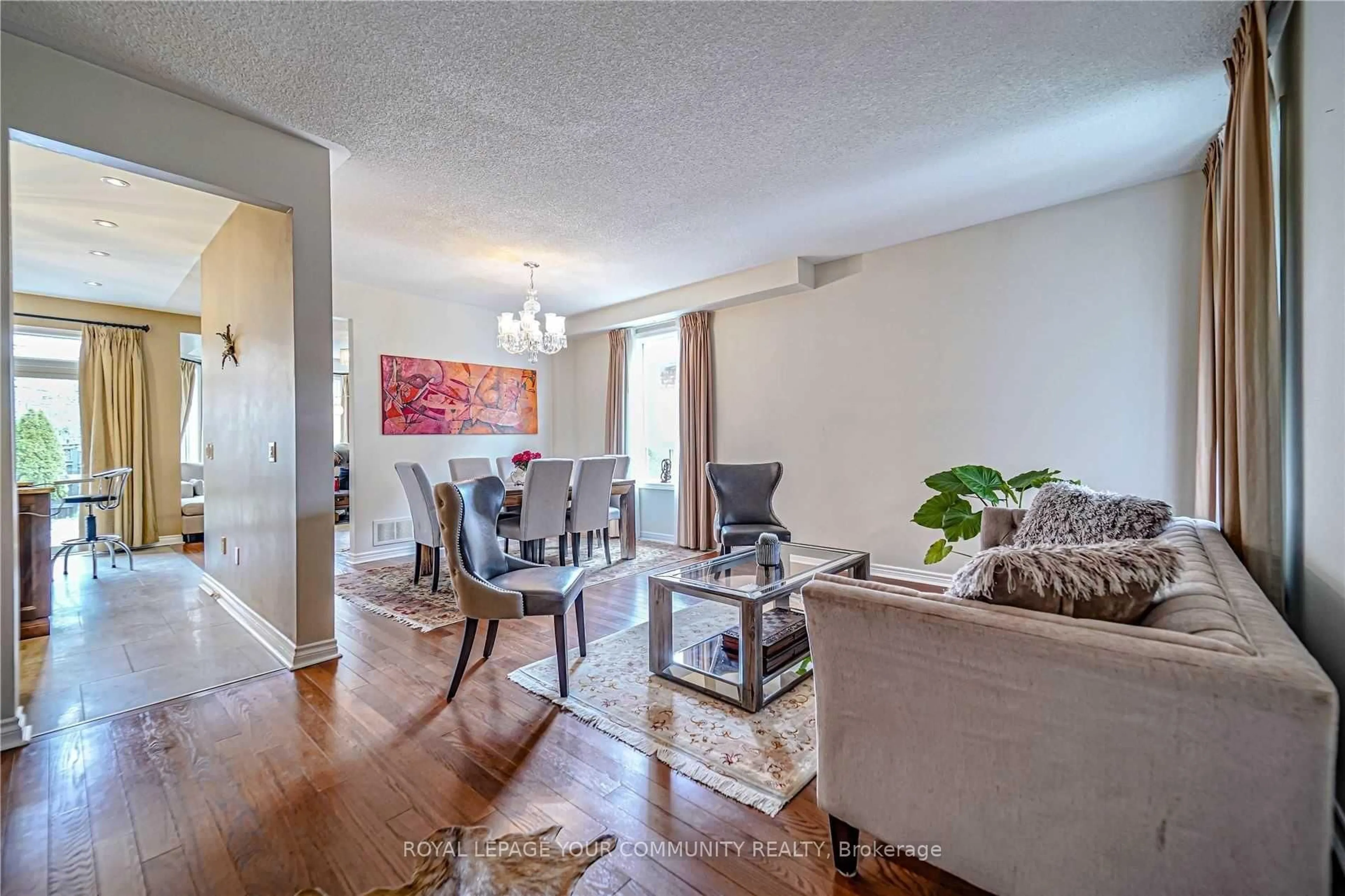 Living room with furniture, wood/laminate floor for 106 Snowy Meadow Ave, Richmond Hill Ontario L4E 3X8
