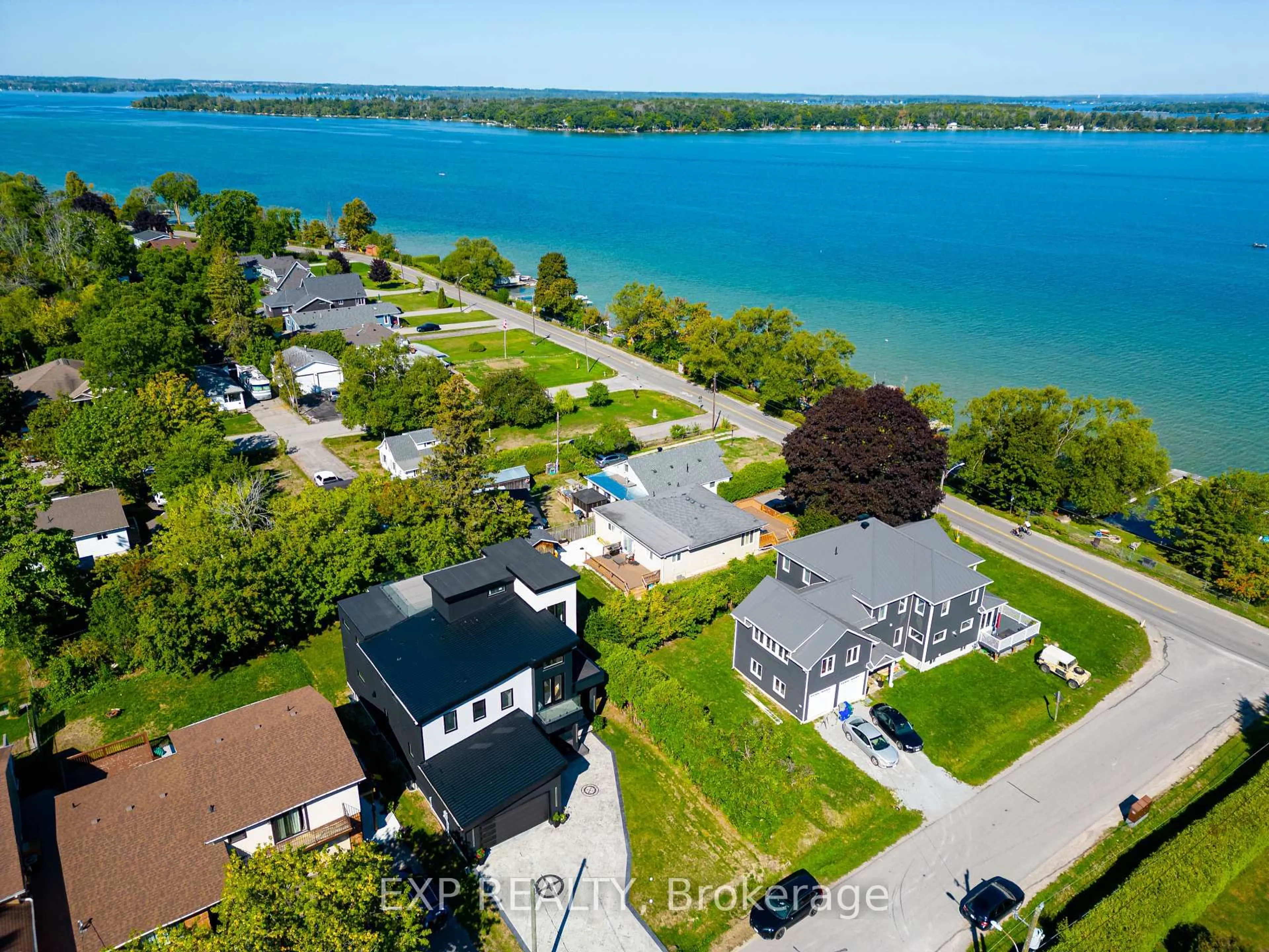 A pic from outside/outdoor area/front of a property/back of a property/a pic from drone, water/lake/river/ocean view for 838 Elmwood St, Georgina Ontario L4P 3E9