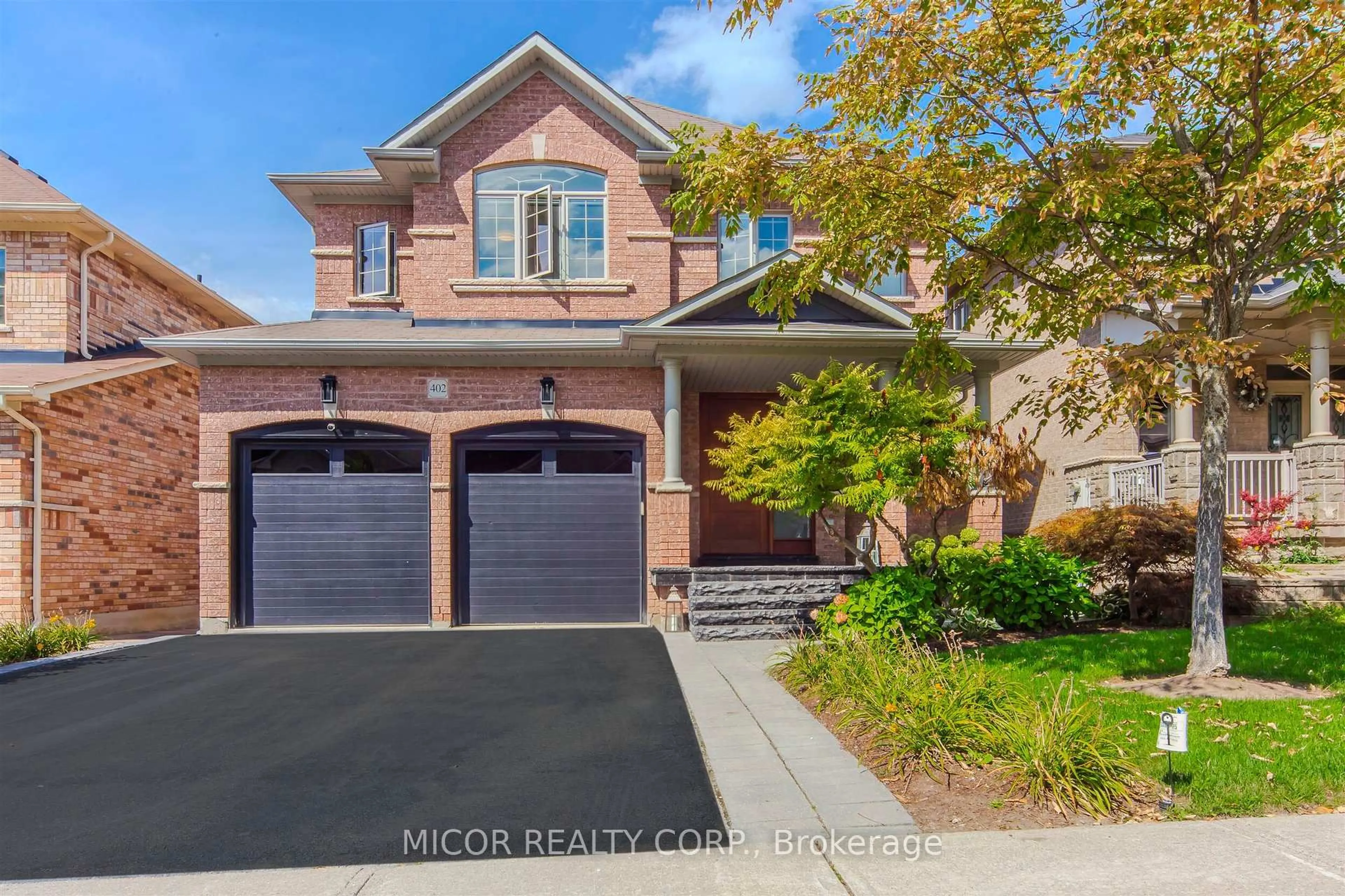 Home with brick exterior material, street for 402 Maria Antonia Rd, Vaughan Ontario L4H 0X5
