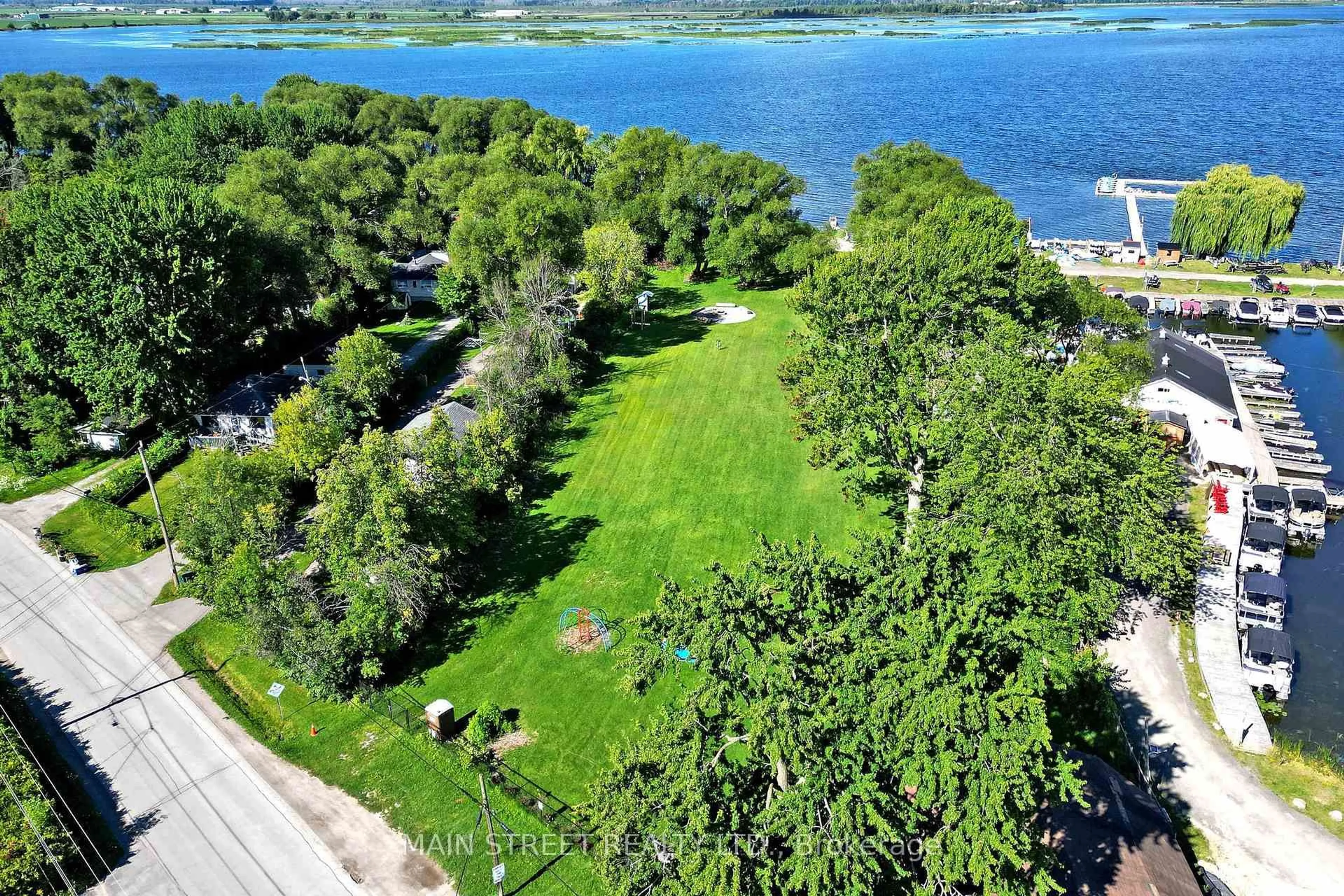 A pic from outside/outdoor area/front of a property/back of a property/a pic from drone, water/lake/river/ocean view for 350 Miami Dr, Georgina Ontario L4P 2Z7