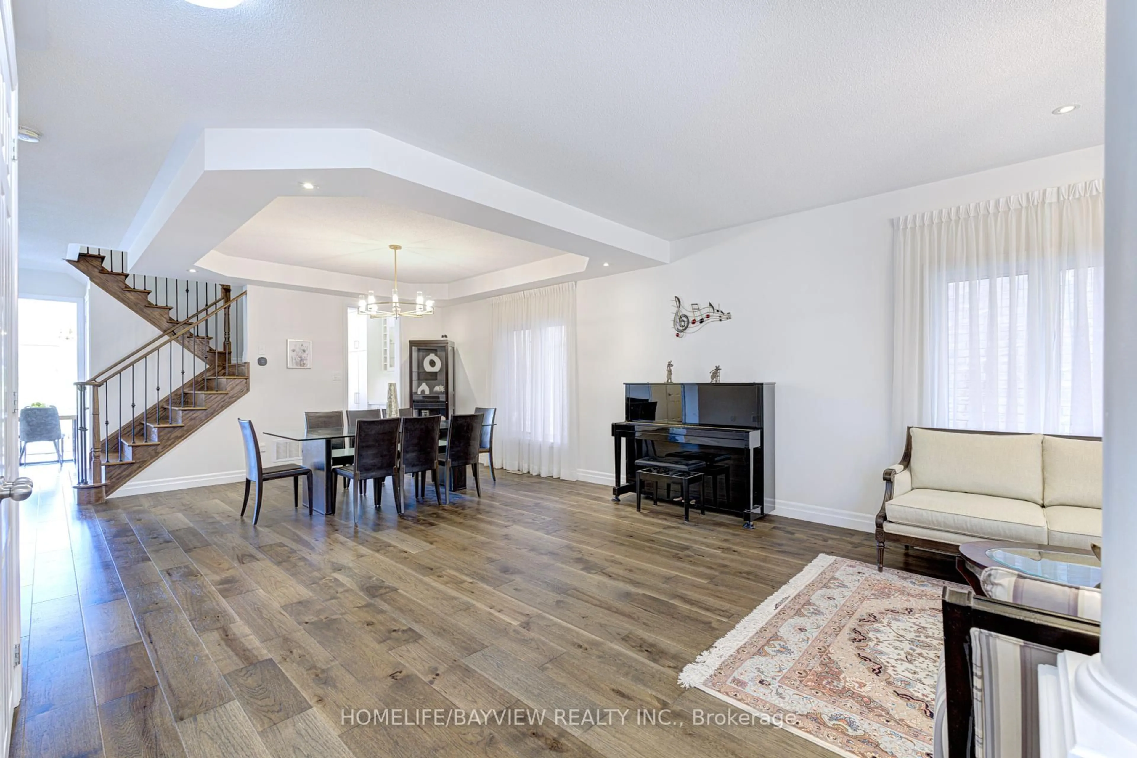 Living room with furniture, wood/laminate floor for 95 Alpaca Dr, Richmond Hill Ontario L4E 0R1