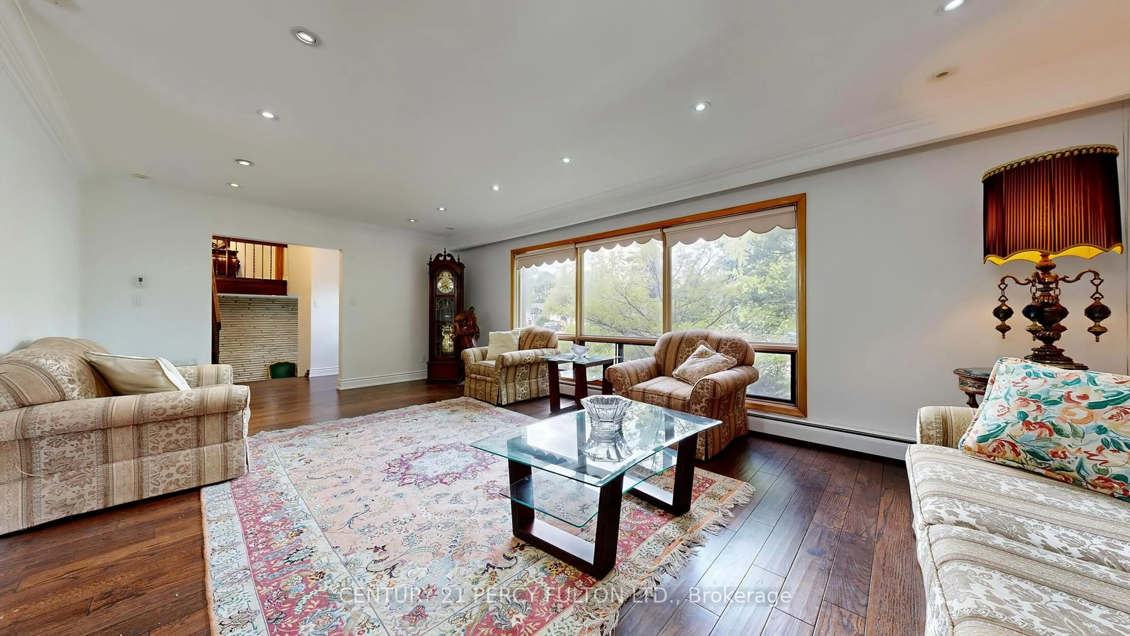 Living room with furniture, wood/laminate floor for 53 Poinsetta Dr, Markham Ontario L3T 2T7