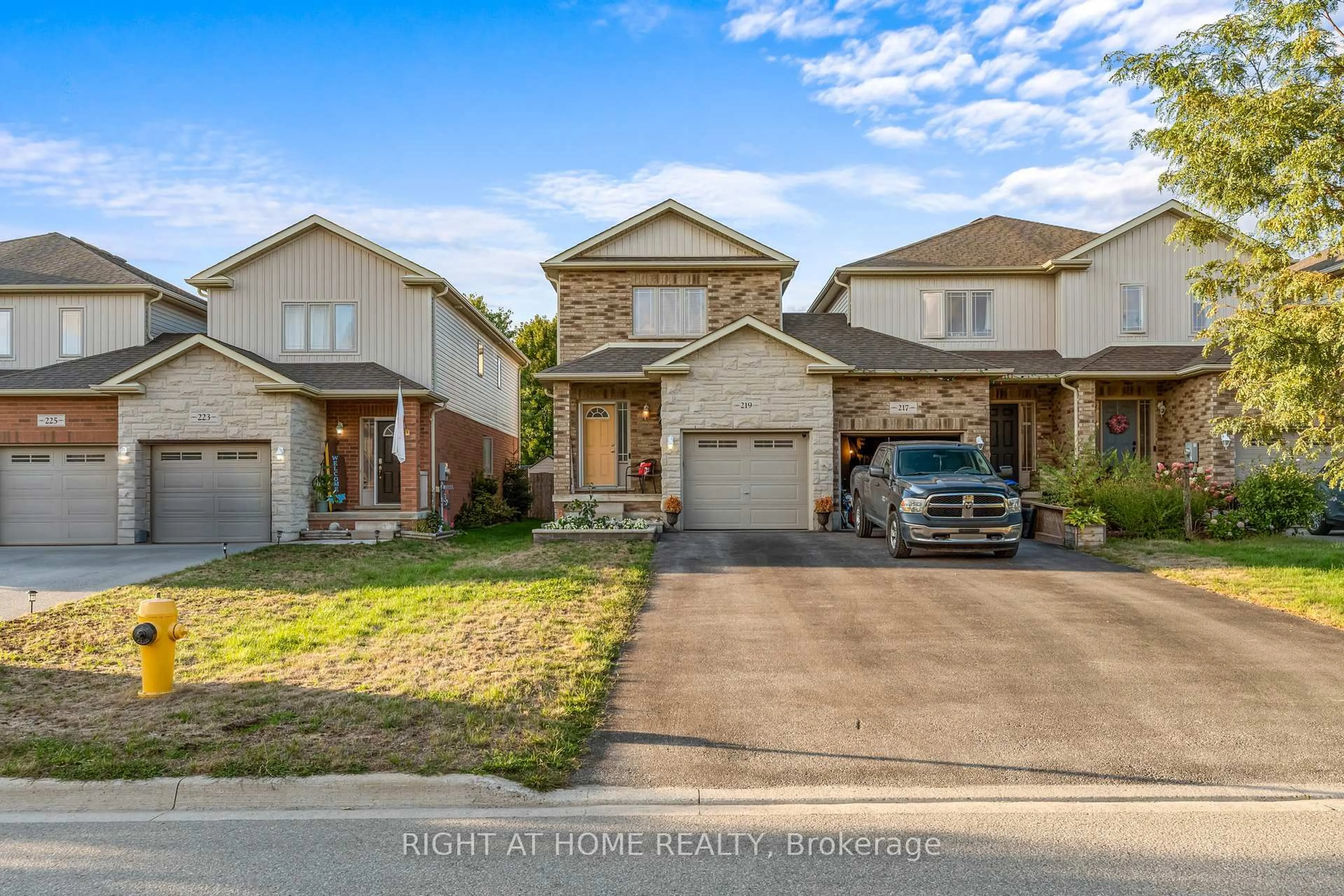 A pic from outside/outdoor area/front of a property/back of a property/a pic from drone, street for 219 Banting Cres, Essa Ontario L3W 0P8