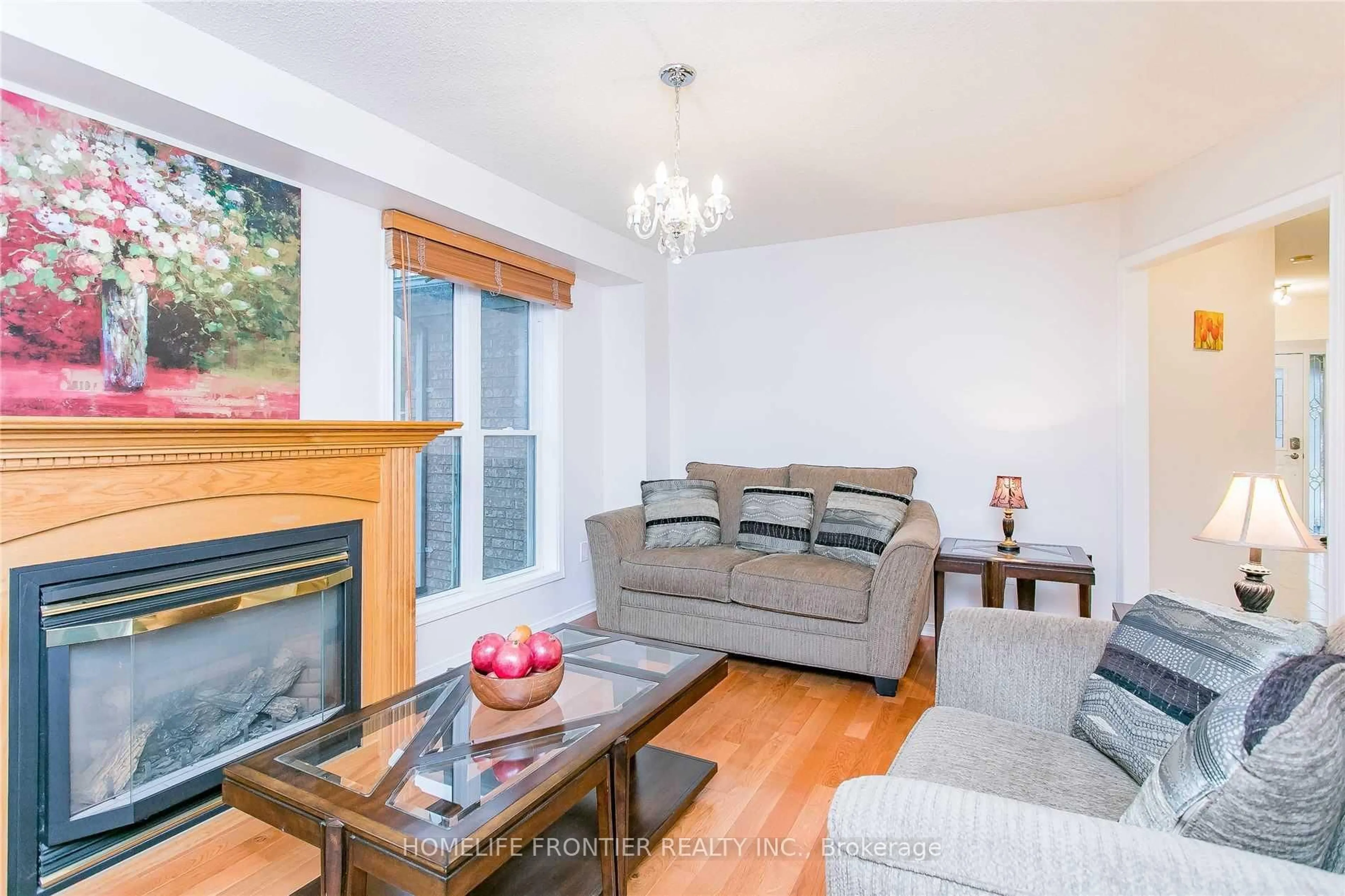 Living room with furniture, wood/laminate floor for 479 Blackstock Rd, Newmarket Ontario L3Y 8H6