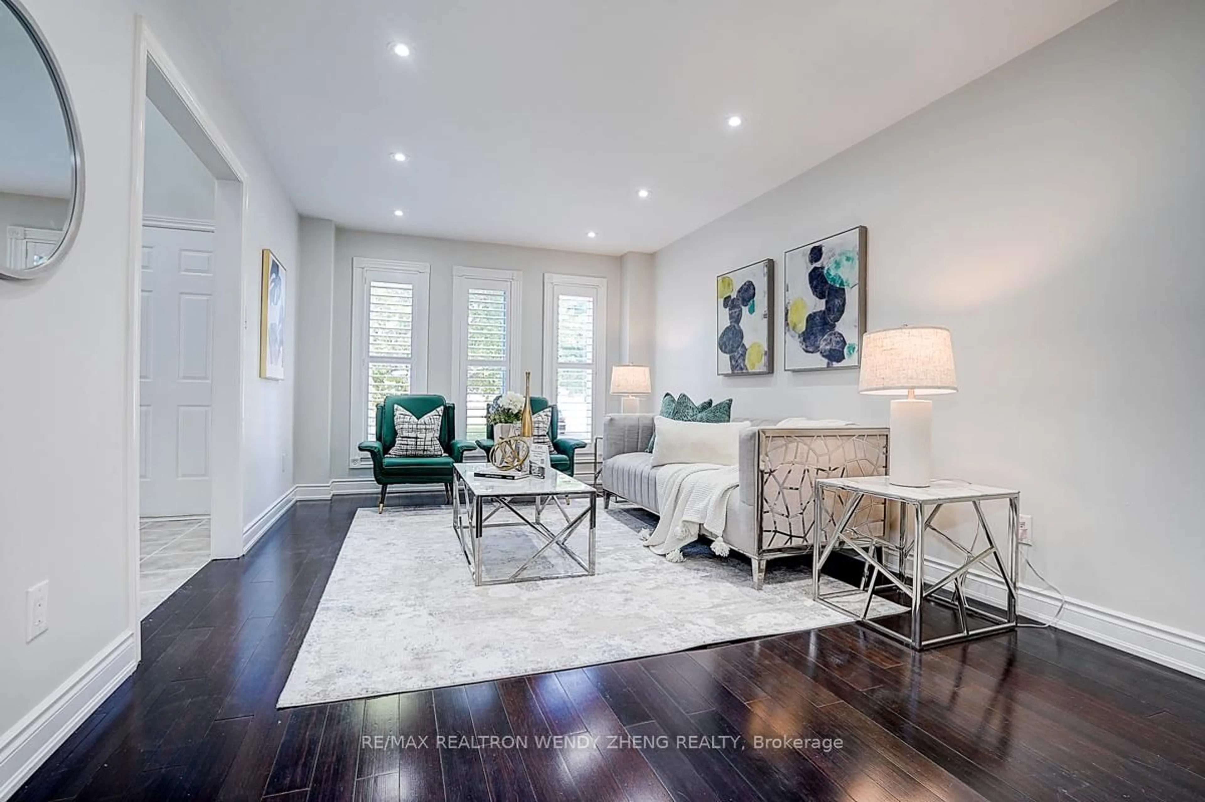 Living room with furniture, wood/laminate floor for 31 Durant Cres, Markham Ontario L3S 3A3